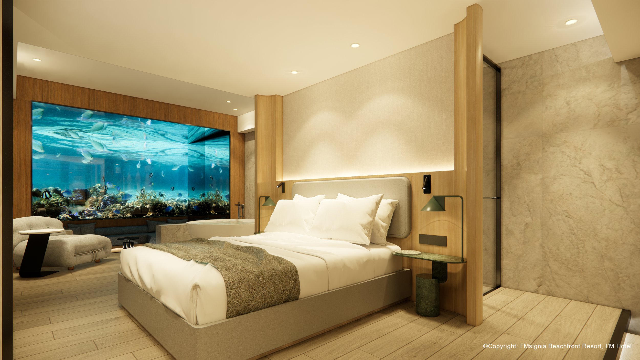 A modern hotel room with a bed, side table, and large aquarium with fish view.