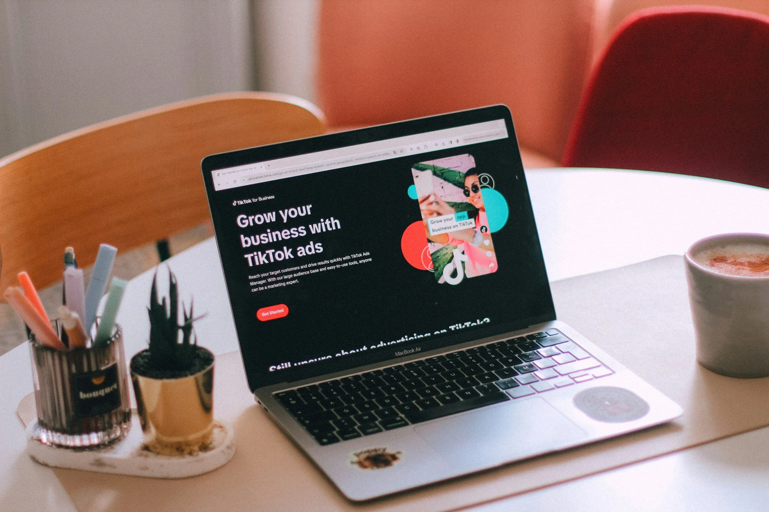 Laptop showing TikTok for Business on a desk