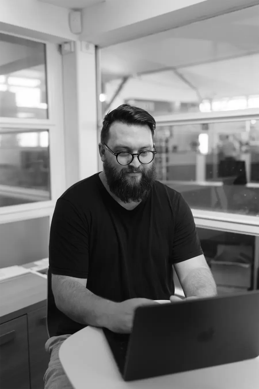 Phil Treagus-Evans working at a laptop