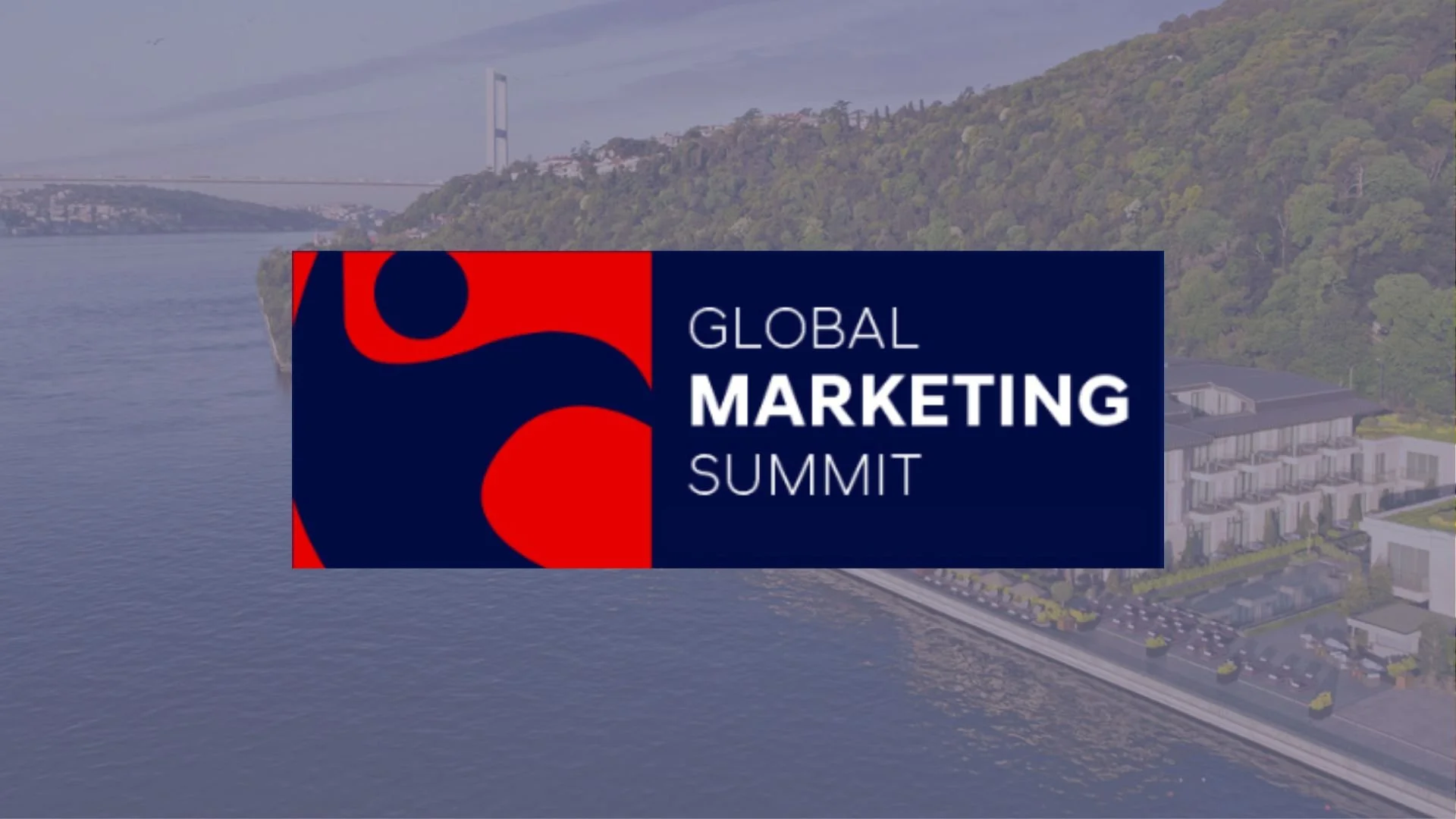 A logo for the Global Marketing Summit overlaying an aerial view of a river, bridge, and cityscape with a forested hillside in the background.