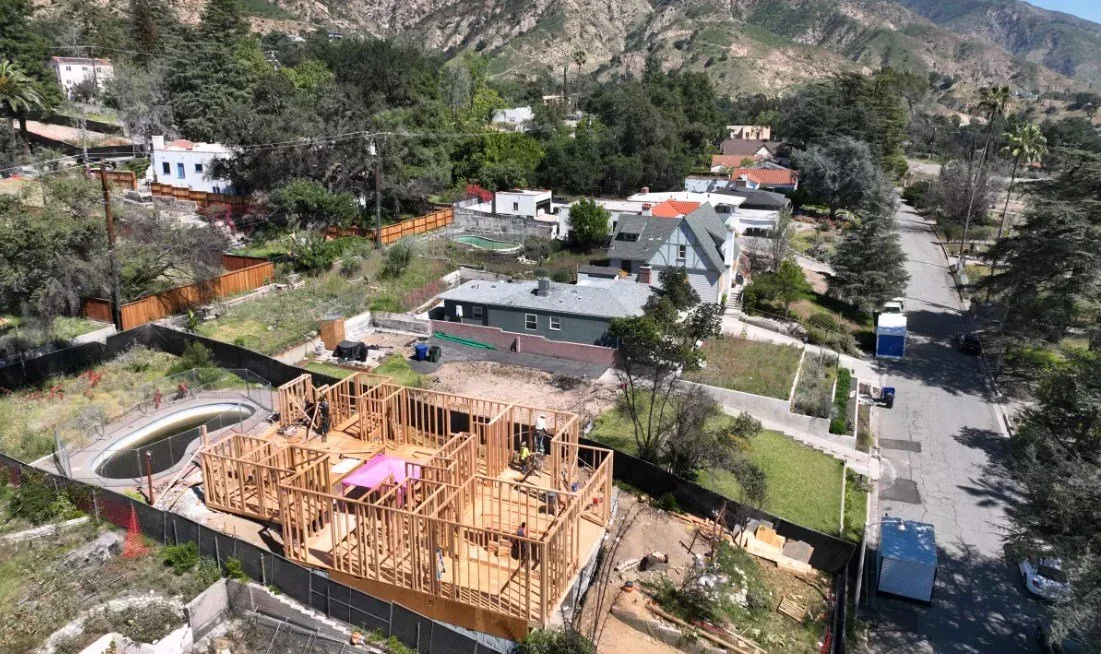 Rebuilding permits in Altadena have picked up, but construction lags and financial woes loom