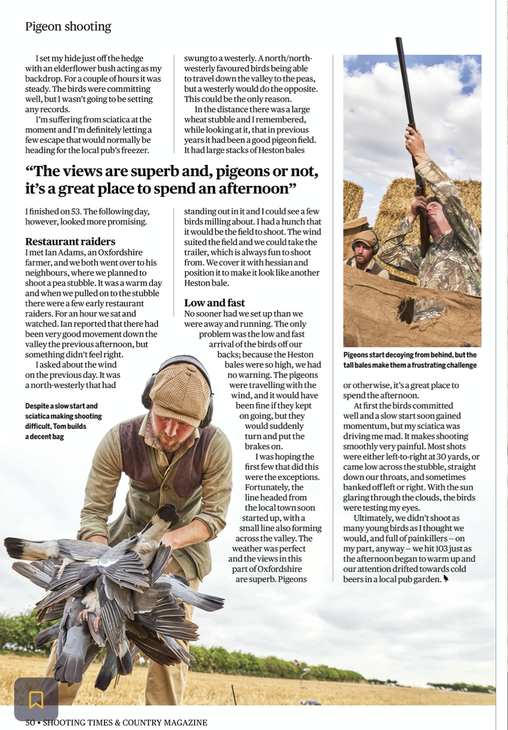 A man in a camouflage jacket and cap holding a long-barreled shotgun, and another man in camouflage and hat in a field with hay bales, decoying pigeons. Pigeons are starting to fly from behind a tall hay bale, creating a challenging situation for the