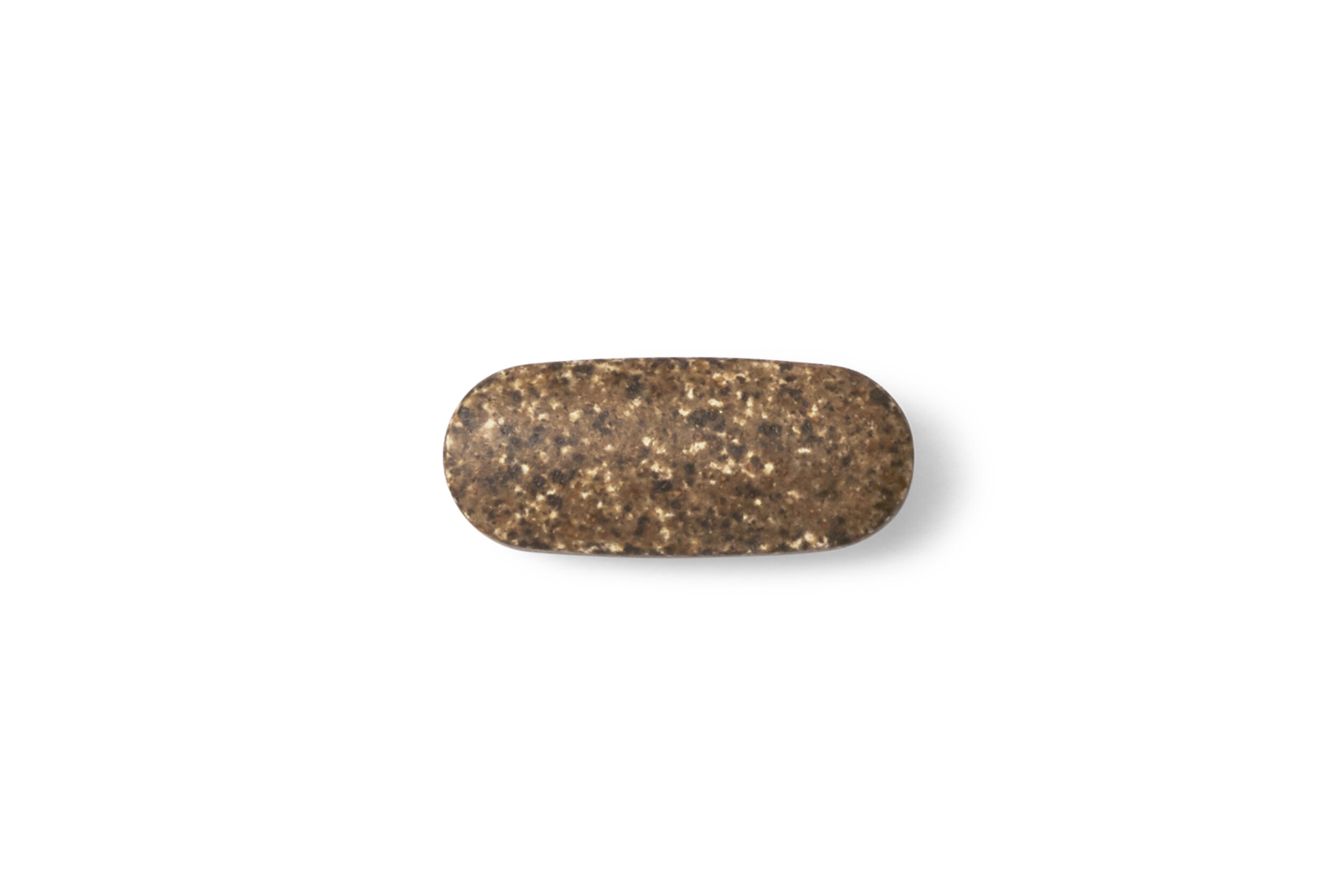 A single speckled brown and black tablet on a white background.