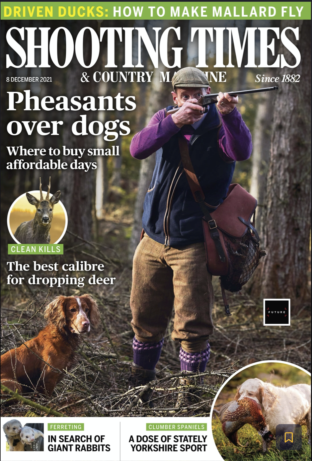 A man in outdoor gear aiming a rifle in a forest, with dogs nearby. The magazine cover features headlines about shooting times, small dog breeds, deer hunting, ferret rabbits, and clumber spaniels.