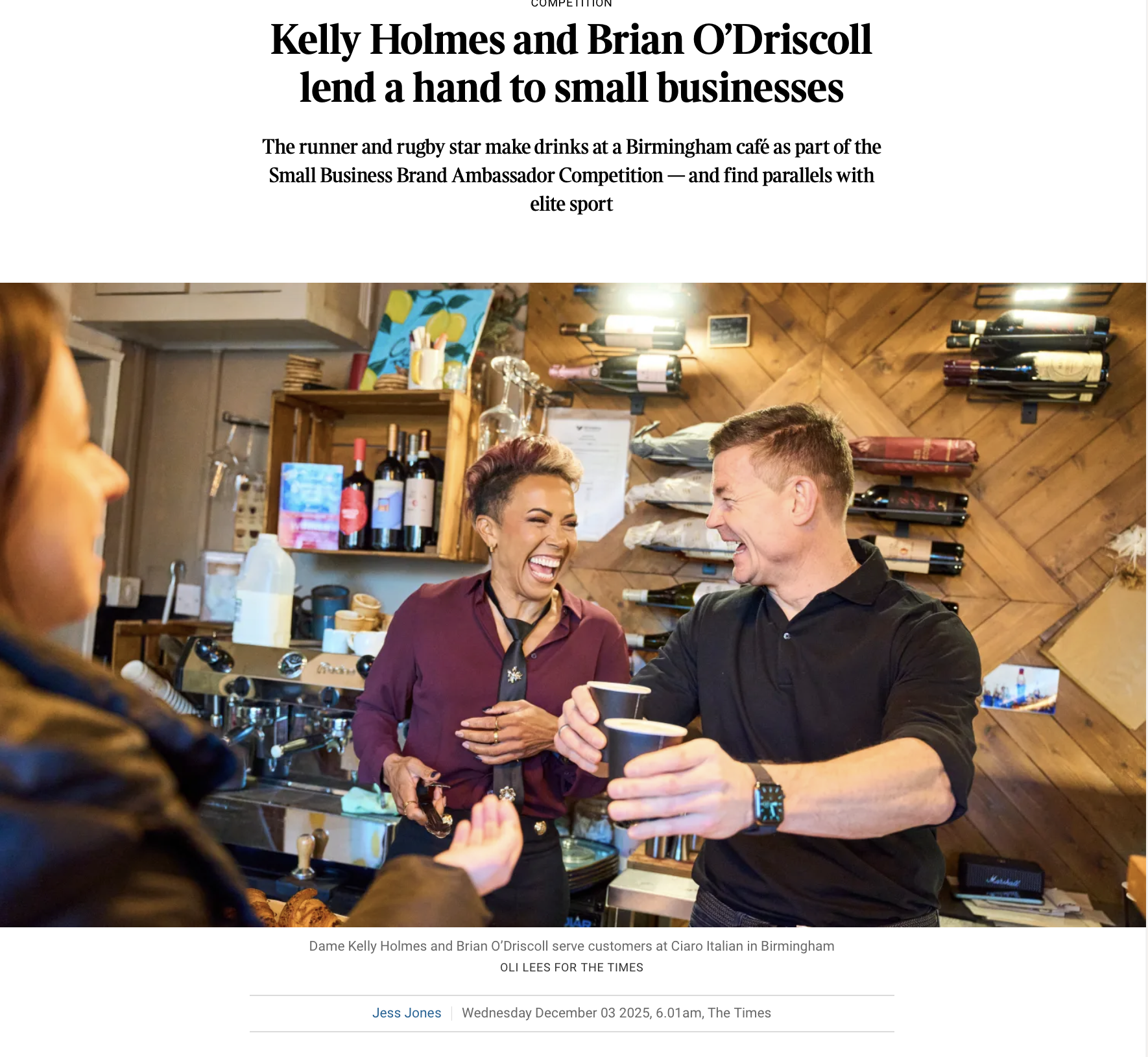 Kelly Holmes and Brian O'Driscoll making drinks at a Birmingham café, smiling and sharing a drink with a customer during a Small Business Brand Ambassador Competition.