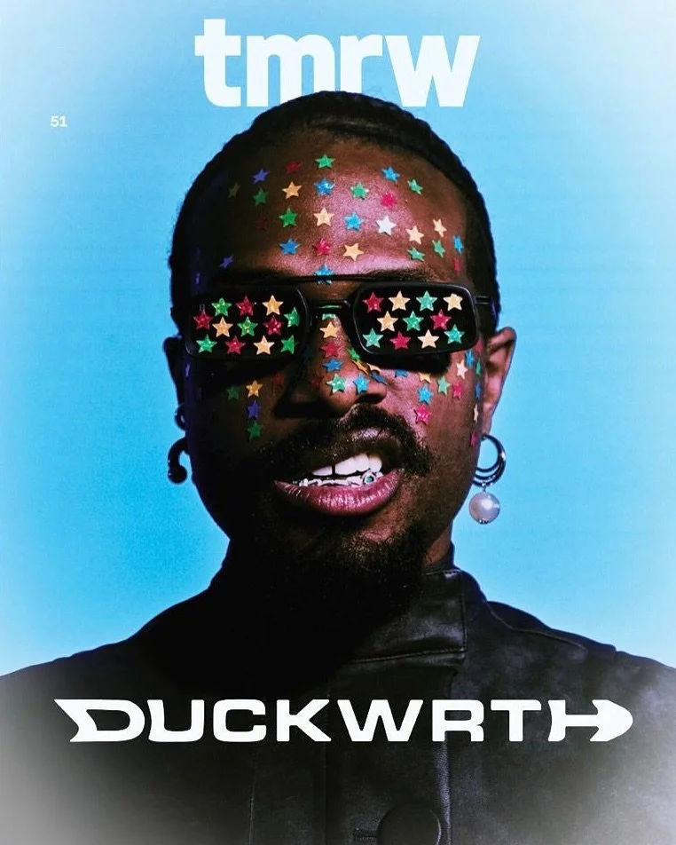 A man wearing sunglasses with star-shaped stickers on his face, set against a blue background with white text and a logo at the bottom.