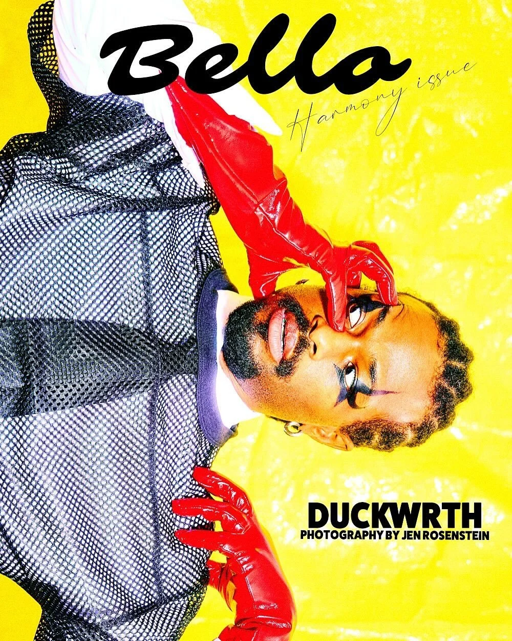 Magazine cover featuring a person with staged makeup and red gloves, lying against a yellow background. The cover text reads 'Hello', 'Harmony Issue', and 'Duckwrth', with a photography credit to Jen Rosenstein.