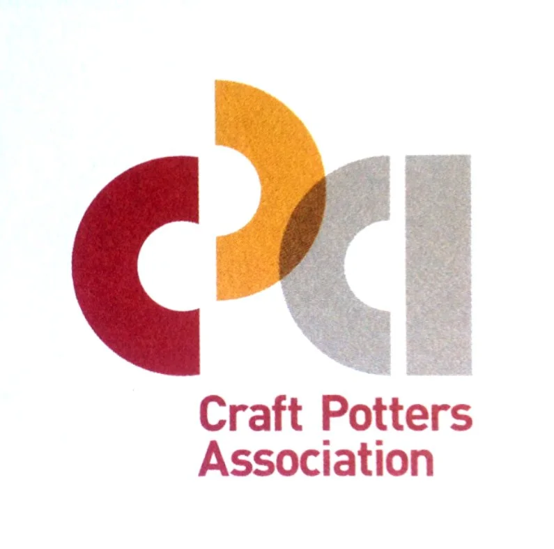 Logo of Craft Potters Association featuring interconnected colored semi-circles in red, orange, and gray, with the organization's name below.