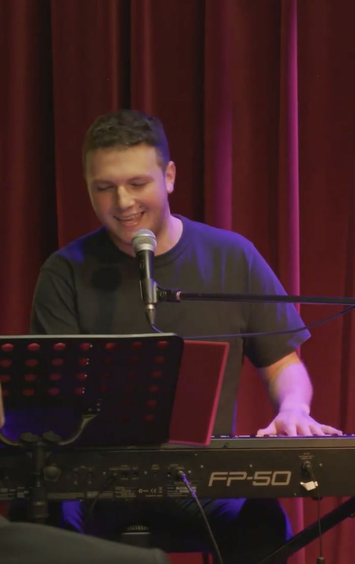 Jake Fehily performing a song from his musical "Matchmaker" 