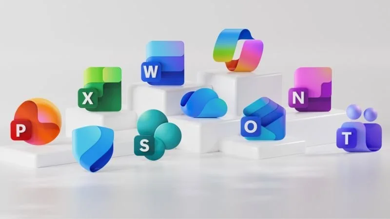 Colorful 3D icons of Microsoft Office applications arranged on white tiered platforms, including PowerPoint, Excel, Word, Outlook, OneDrive, Teams, and other apps.