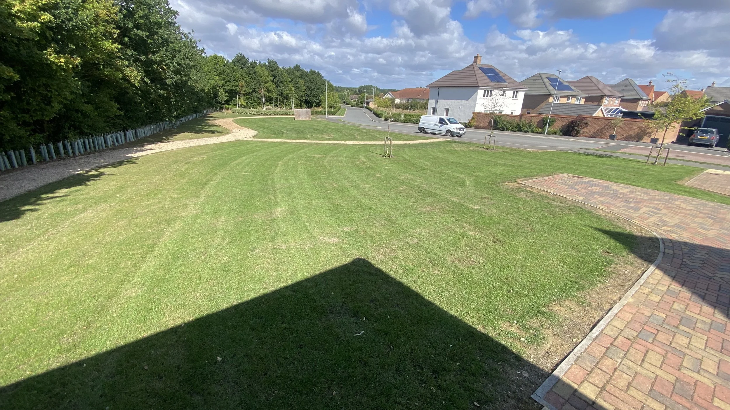Housing estate grass cutting striped grass grounds maintenance