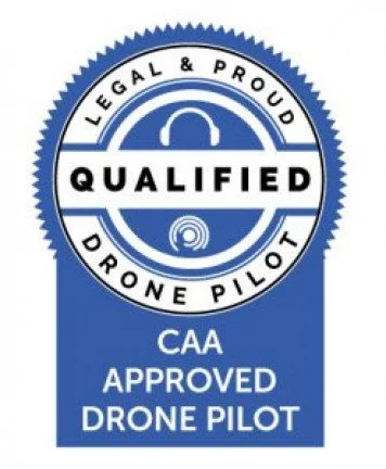 A official certification badge for a licensed drone pilot, featuring the words 'Legal & Proud', 'Qualified', 'CAA Approved Drone Pilot' and a blue circular design.