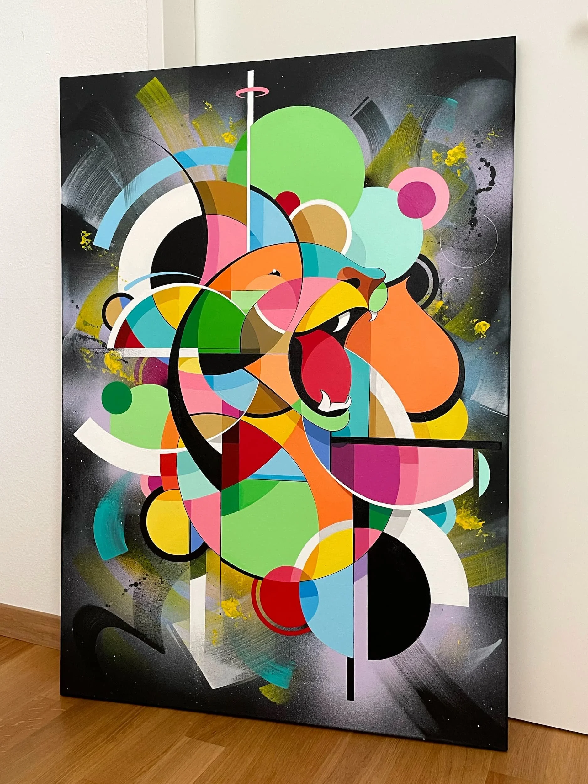 Abstract colorful painting of a roaring lion's head on a canvas, featuring various geometric shapes and vibrant colors.