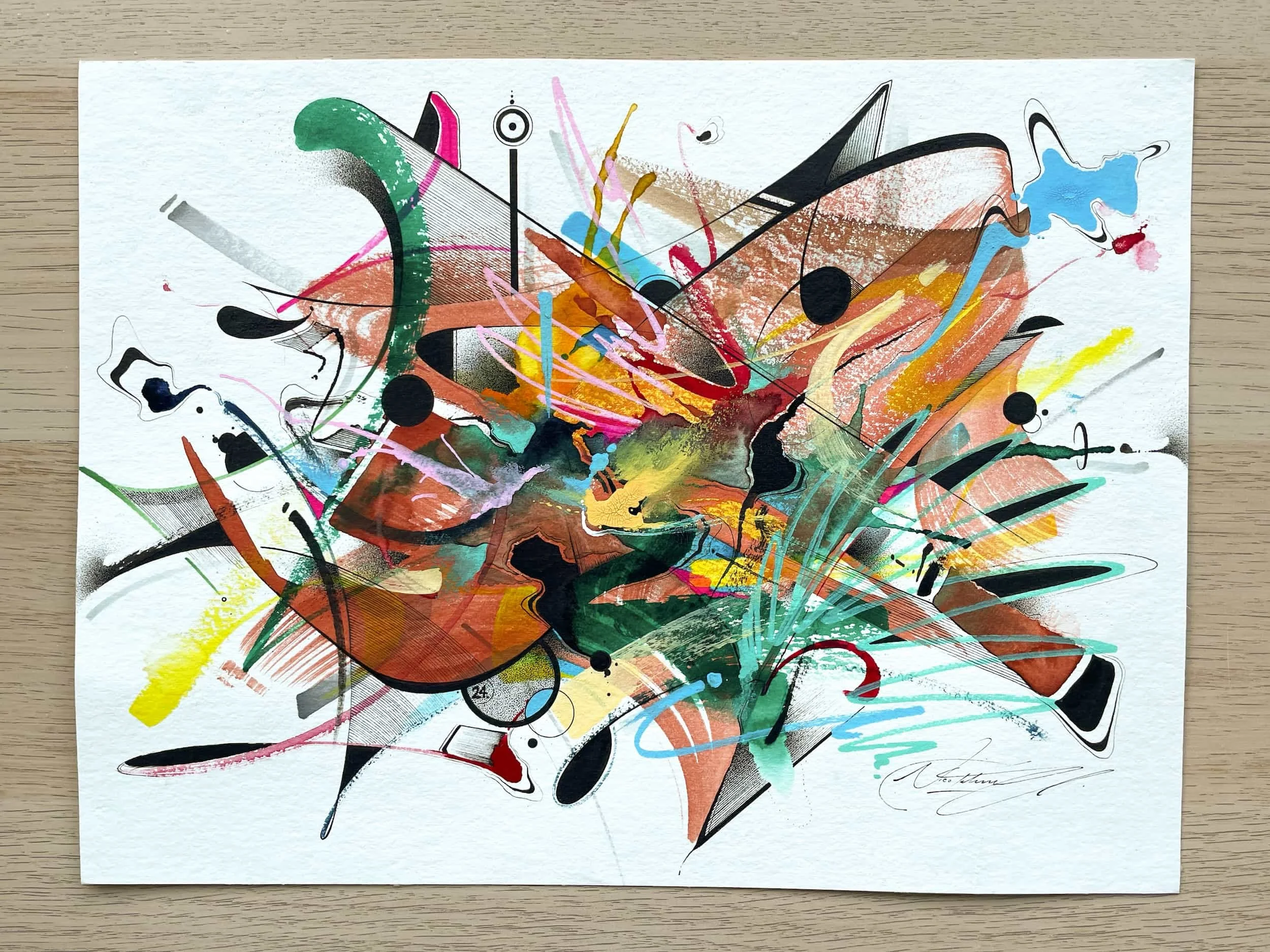 Abstract colorful splashes and strokes of paint on white paper, featuring black dots and various lines, with a signature in the bottom right corner.