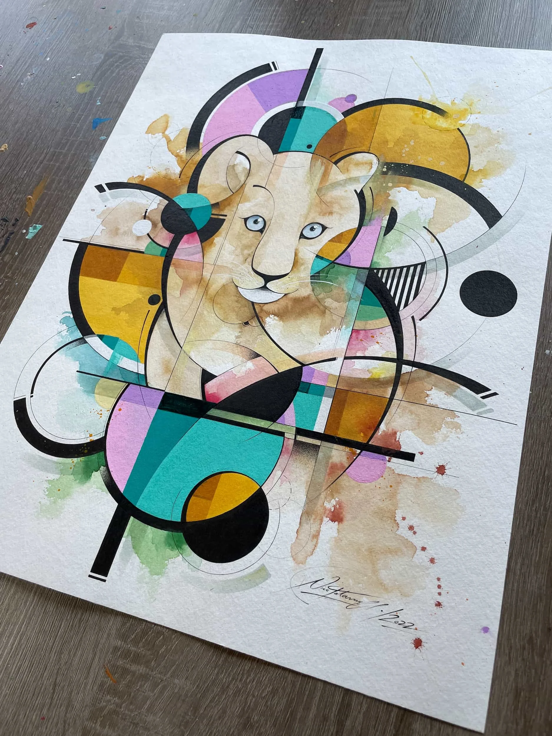 Abstract watercolor style art featuring a lioness with geometric shapes and splashes of vibrant colors.