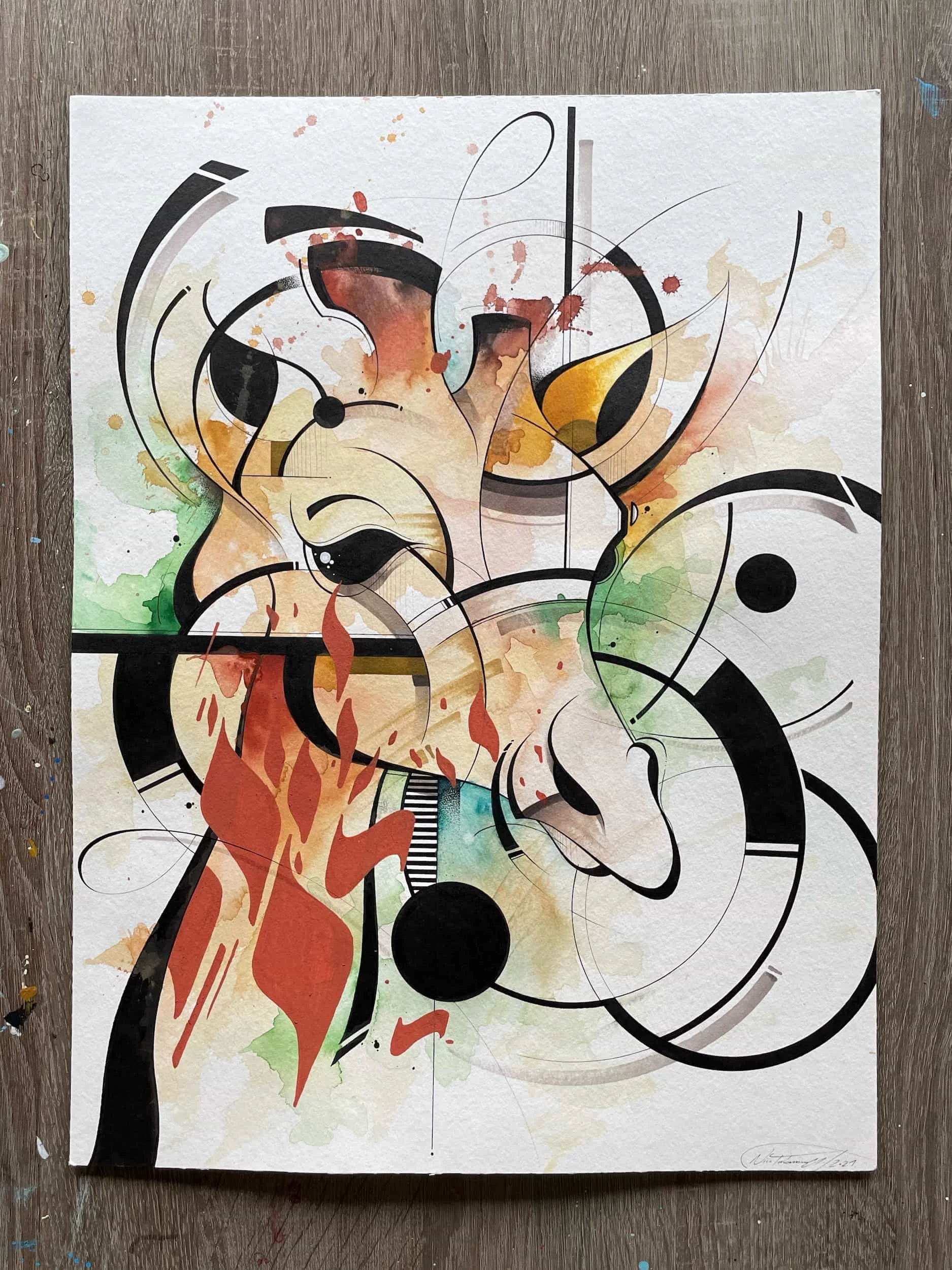 Abstract watercolor painting featuring geometric shapes, splashes of colors like red, green, yellow, and black, with overlapping lines and circular elements on textured paper.