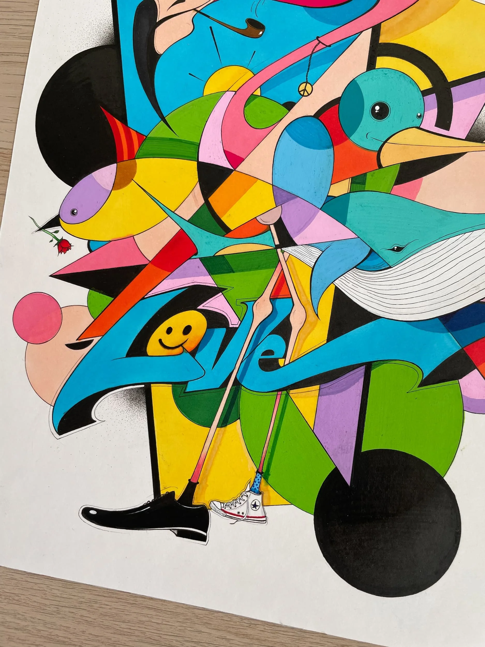Colorful abstract drawing featuring a whale with a smiley face, a bird, a rose, a ball, a pair of sneakers, and various geometric shapes and patterns in bright colors.