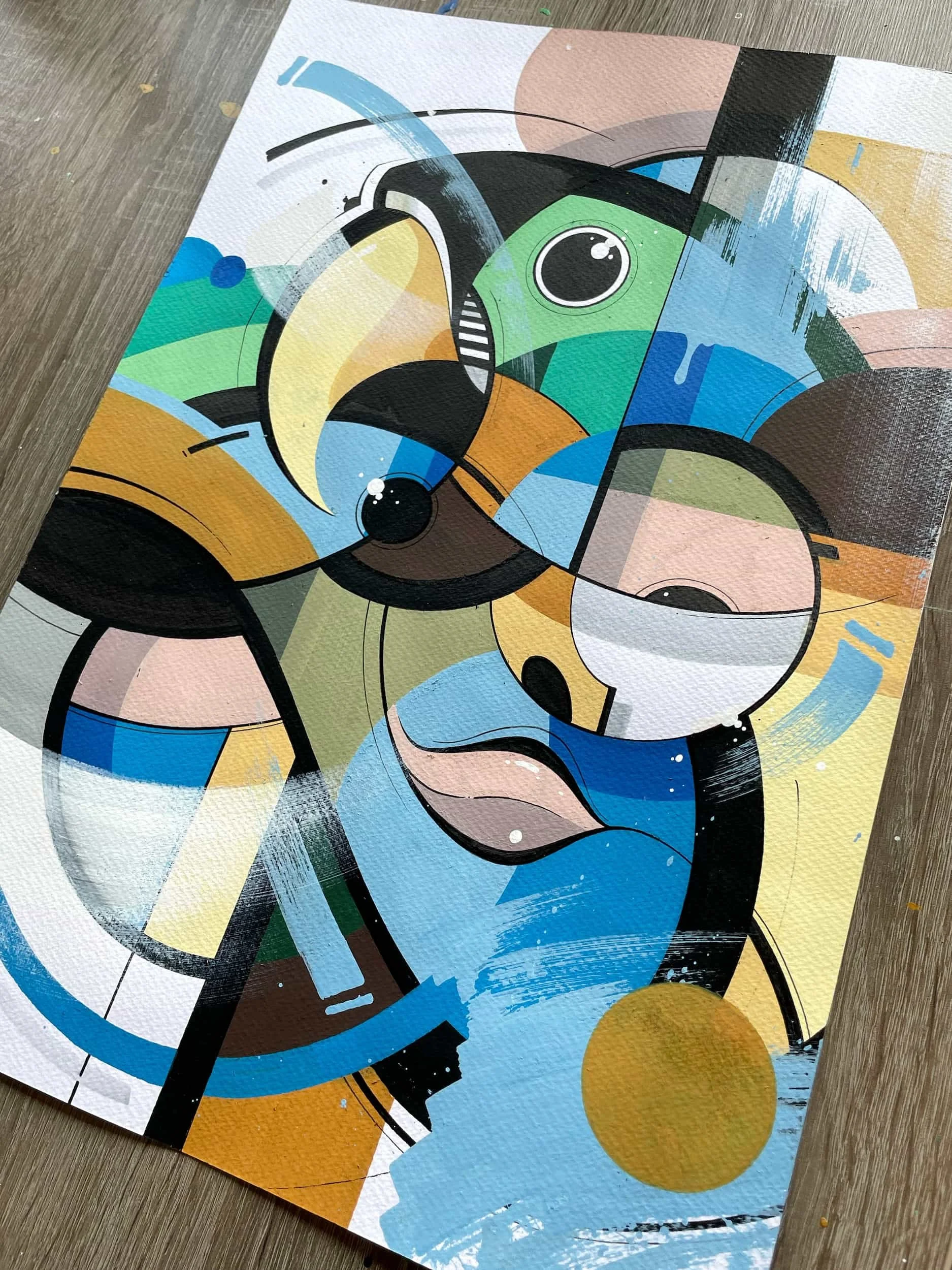 Abstract colorful art with cartoonish toucan bird face, including green, yellow, blue, and black shapes and lines.