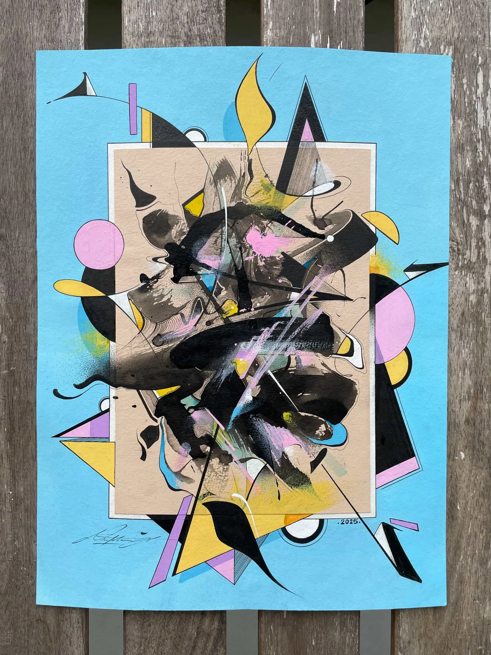 Abstract colorful artwork with geometric shapes and energetic brush strokes on a blue background.