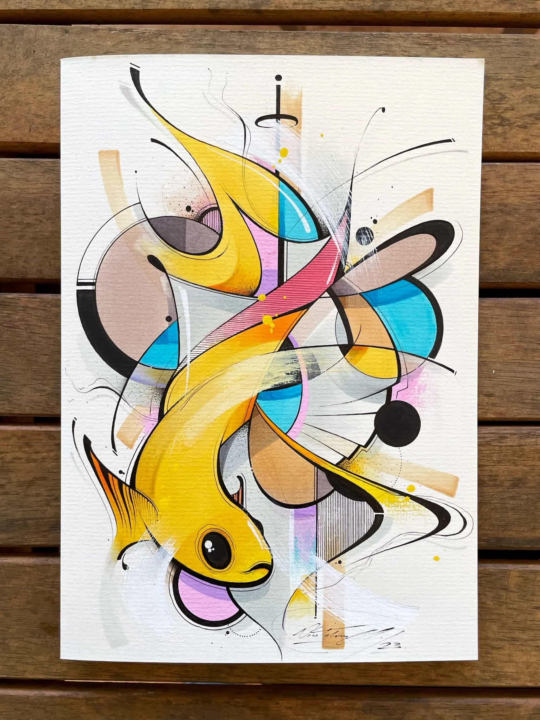 Abstract geometric artwork featuring a goldfish, with vibrant colors including yellow, pink, blue, black, and beige, set against a textured white background.
