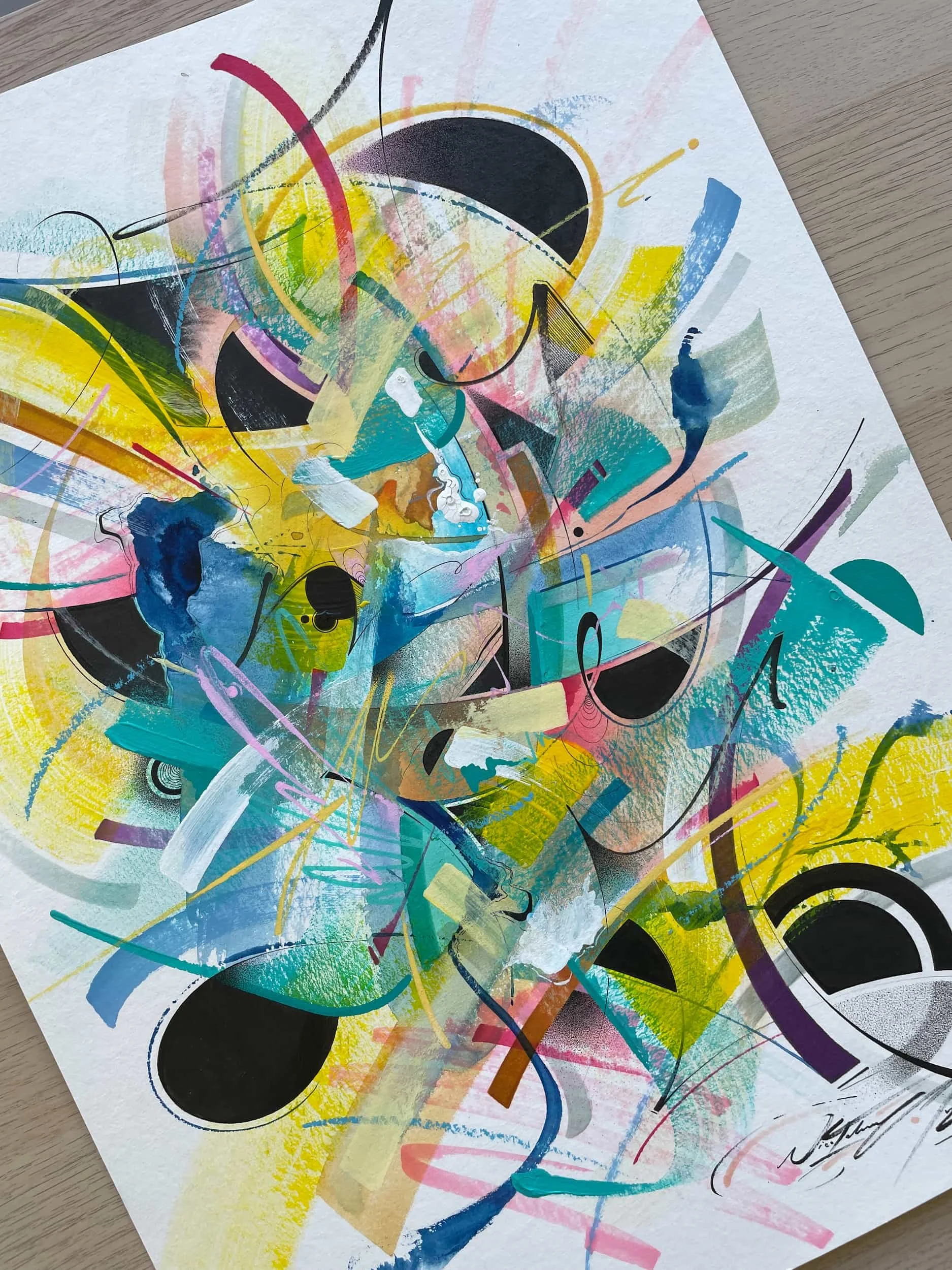 Abstract colorful painting with various shapes, lines, and splashes of paint including black circles, yellow, blue, pink, and purple strokes.