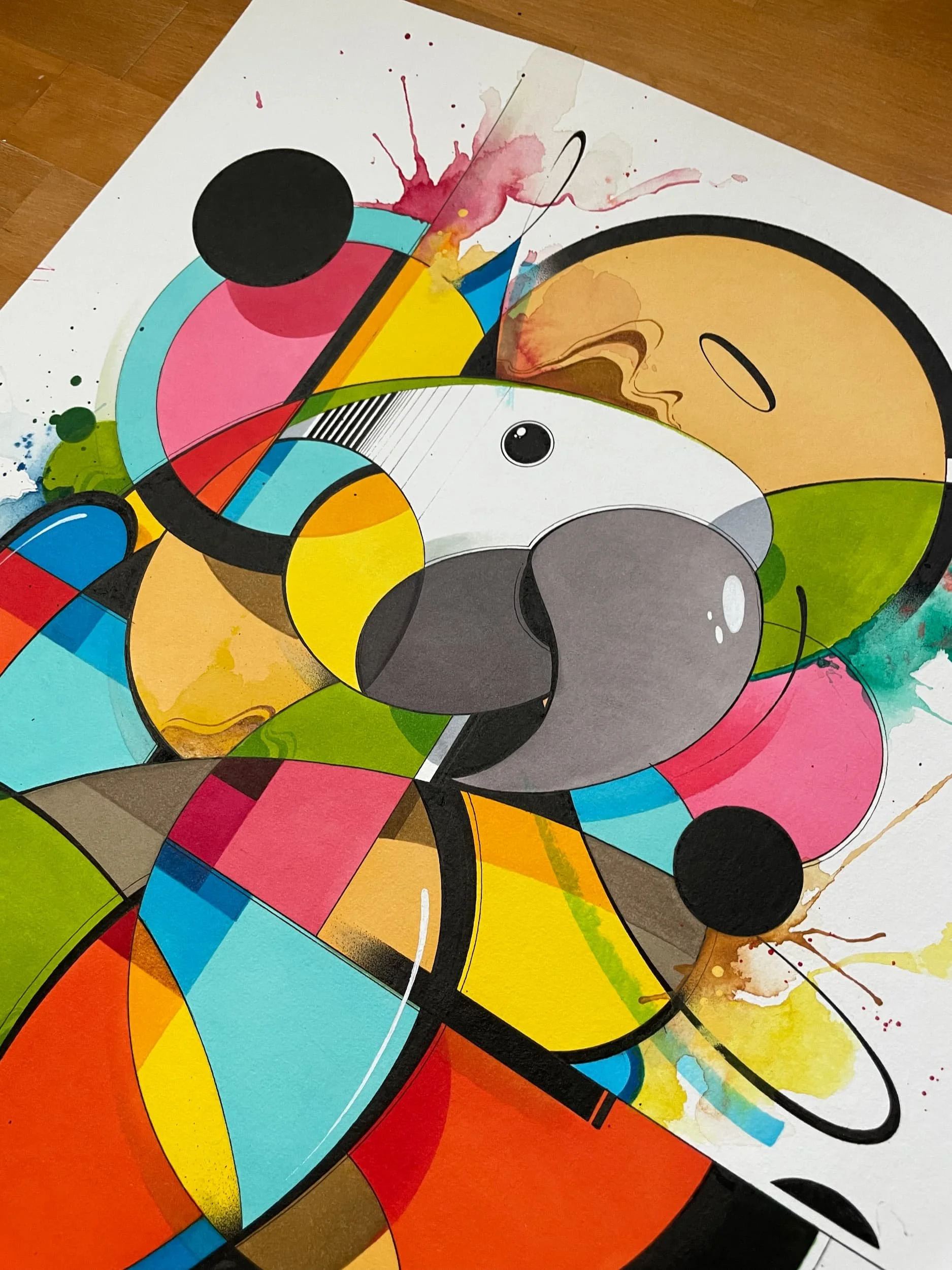 A colorful abstract art piece with geometric shapes, splashes of paint, and a stylized panda face.
