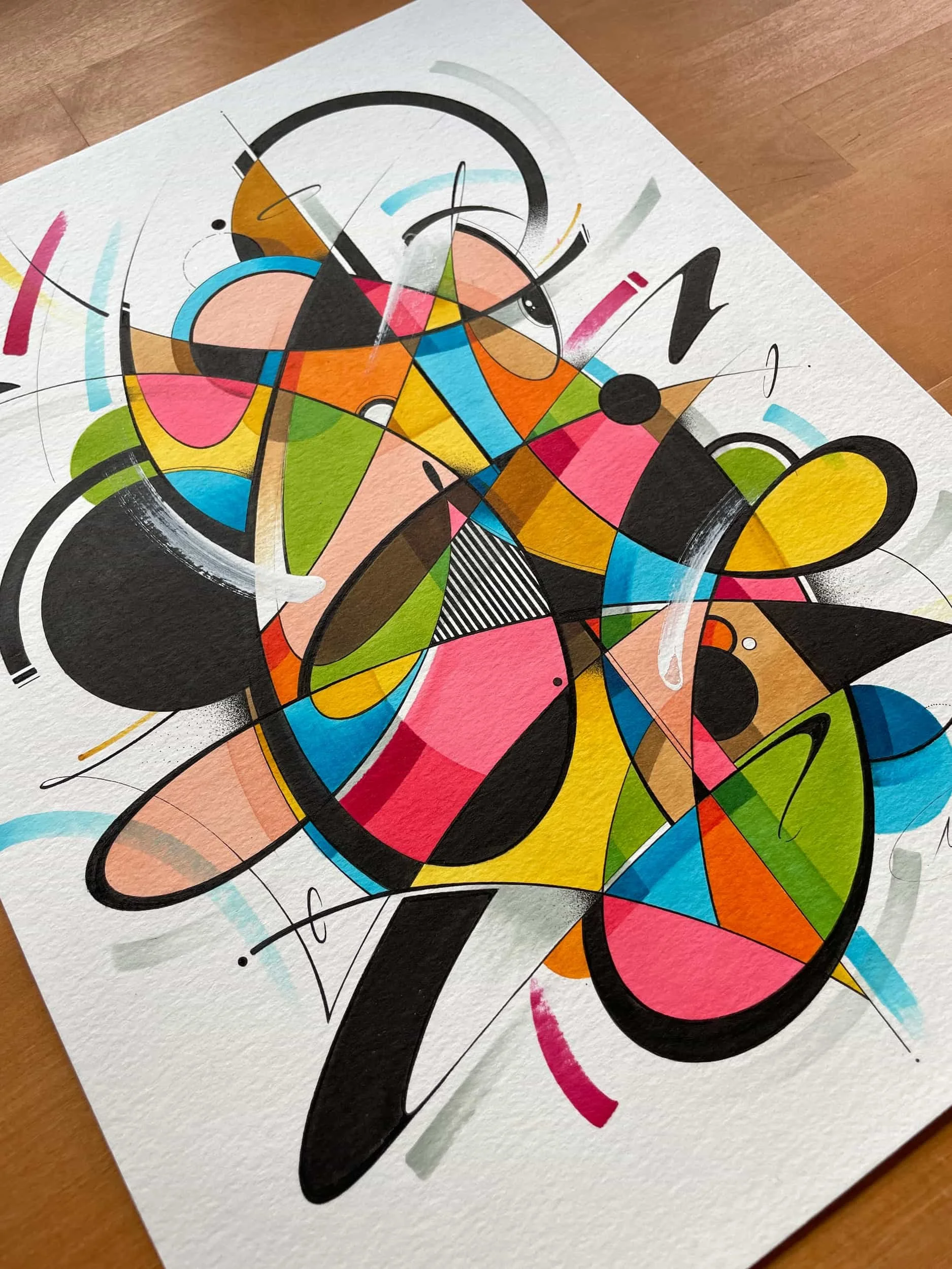 Abstract colorful geometric painting on paper with various shapes, lines, and splashes of color.