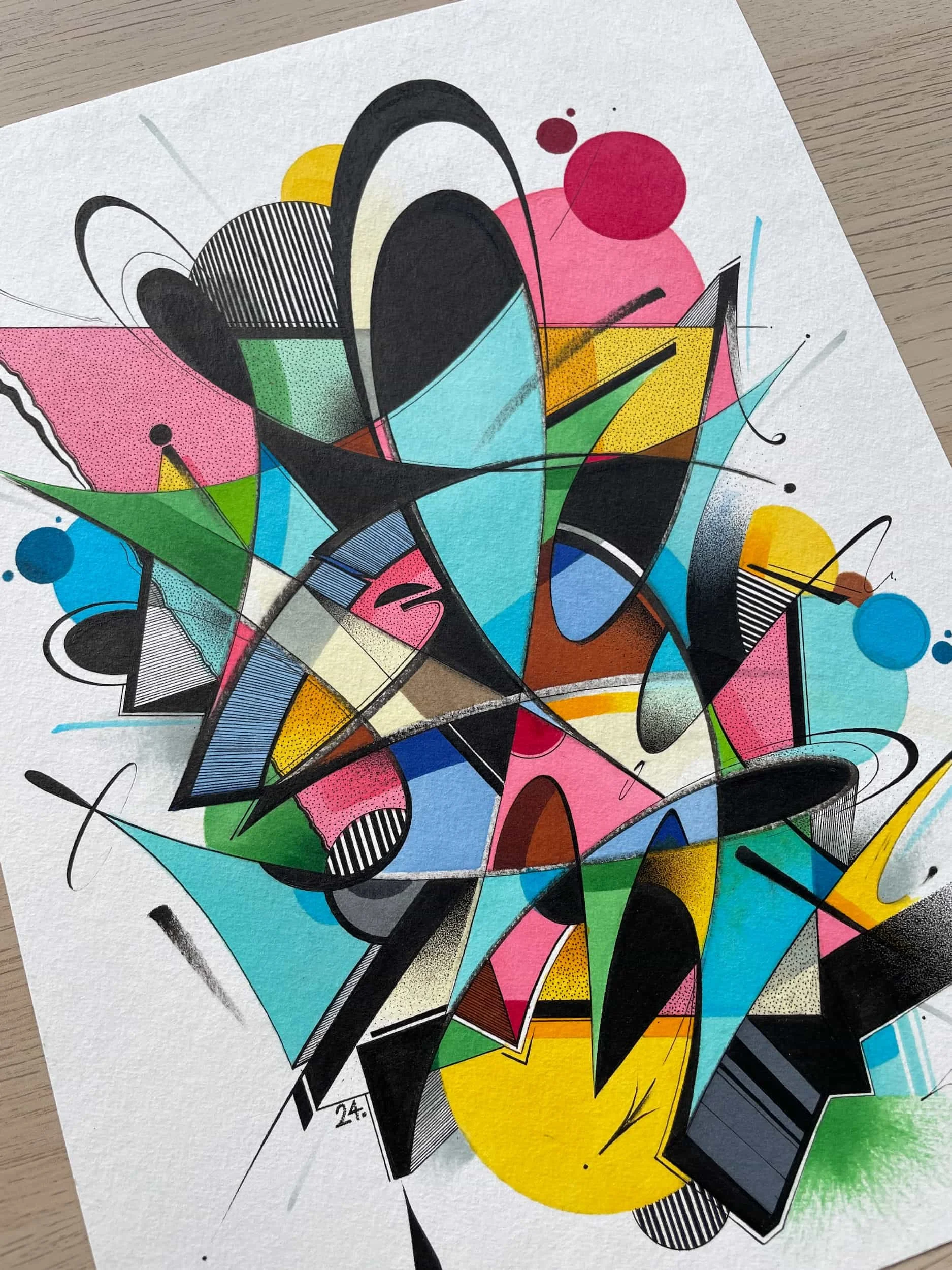 Abstract colorful graffiti art with geometric shapes, splashes, and lines on white paper.