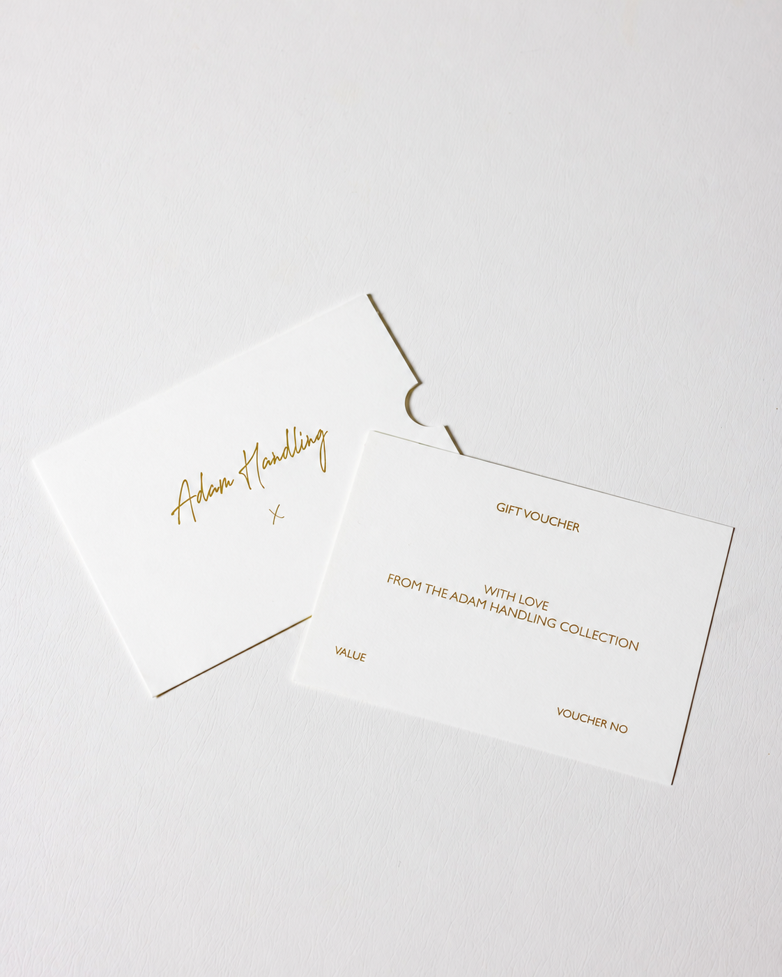 Elegant gold gift voucher on white.png