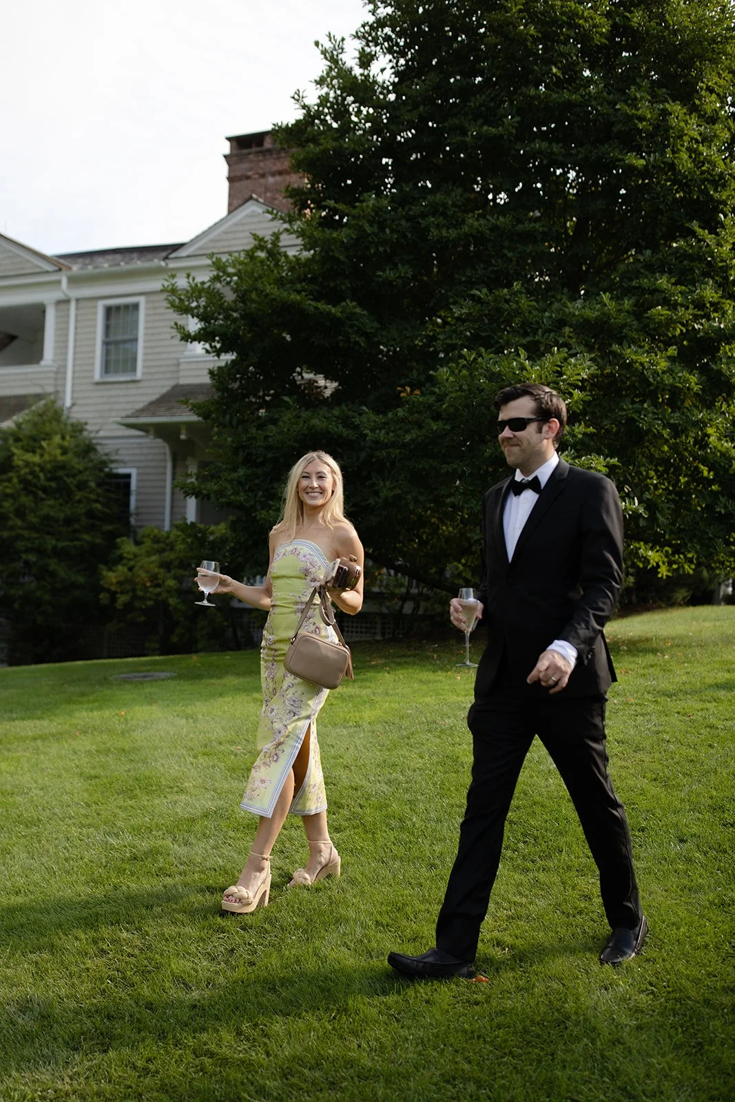 Couple walking to Cocktail Hour designed by 42 North World | Freda Banks Photography | Mayflower Inn & Spa Auberge