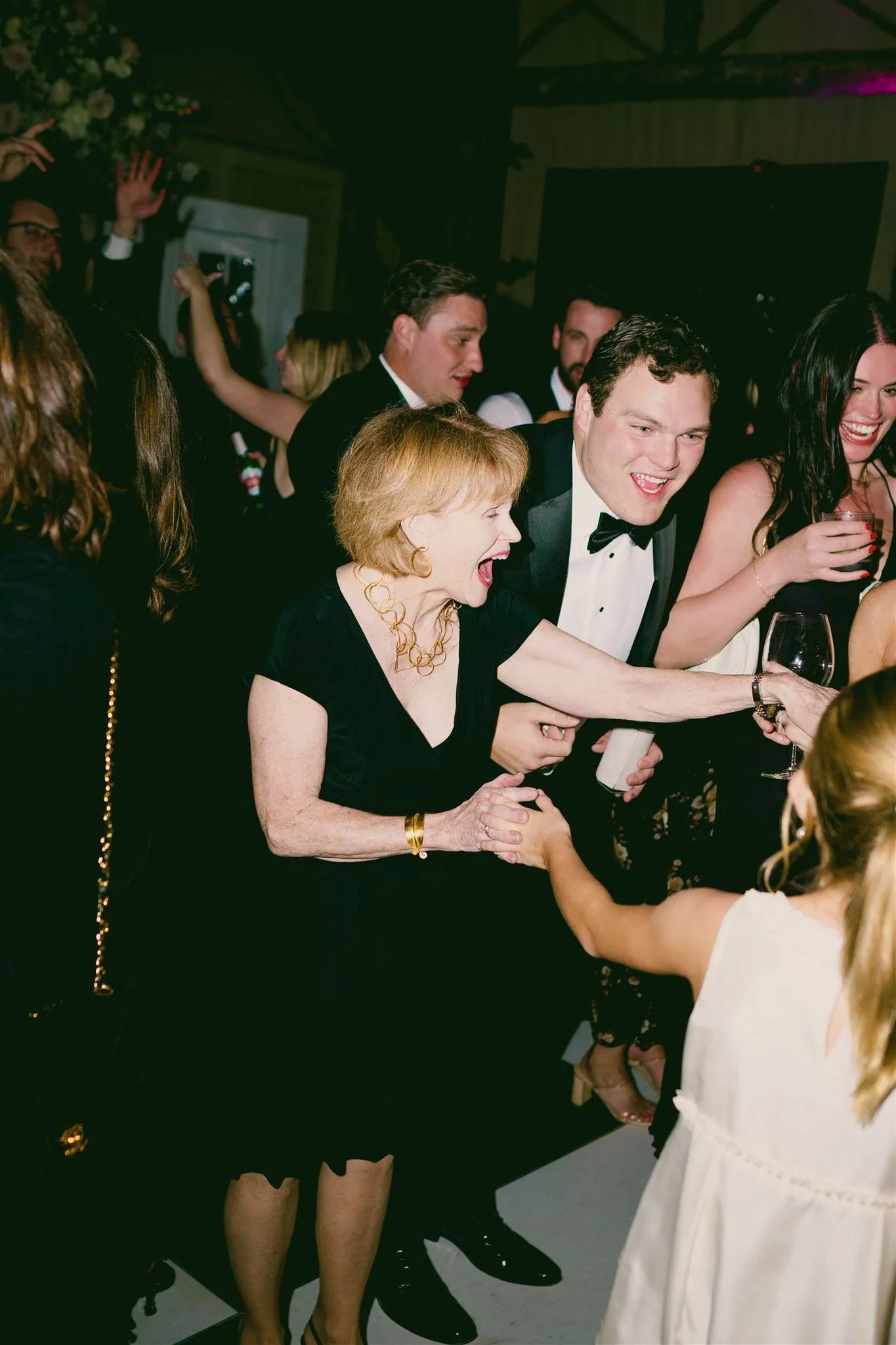 Wedding guests dancing with custom, luxury musical ensemble, T. Warner Artists