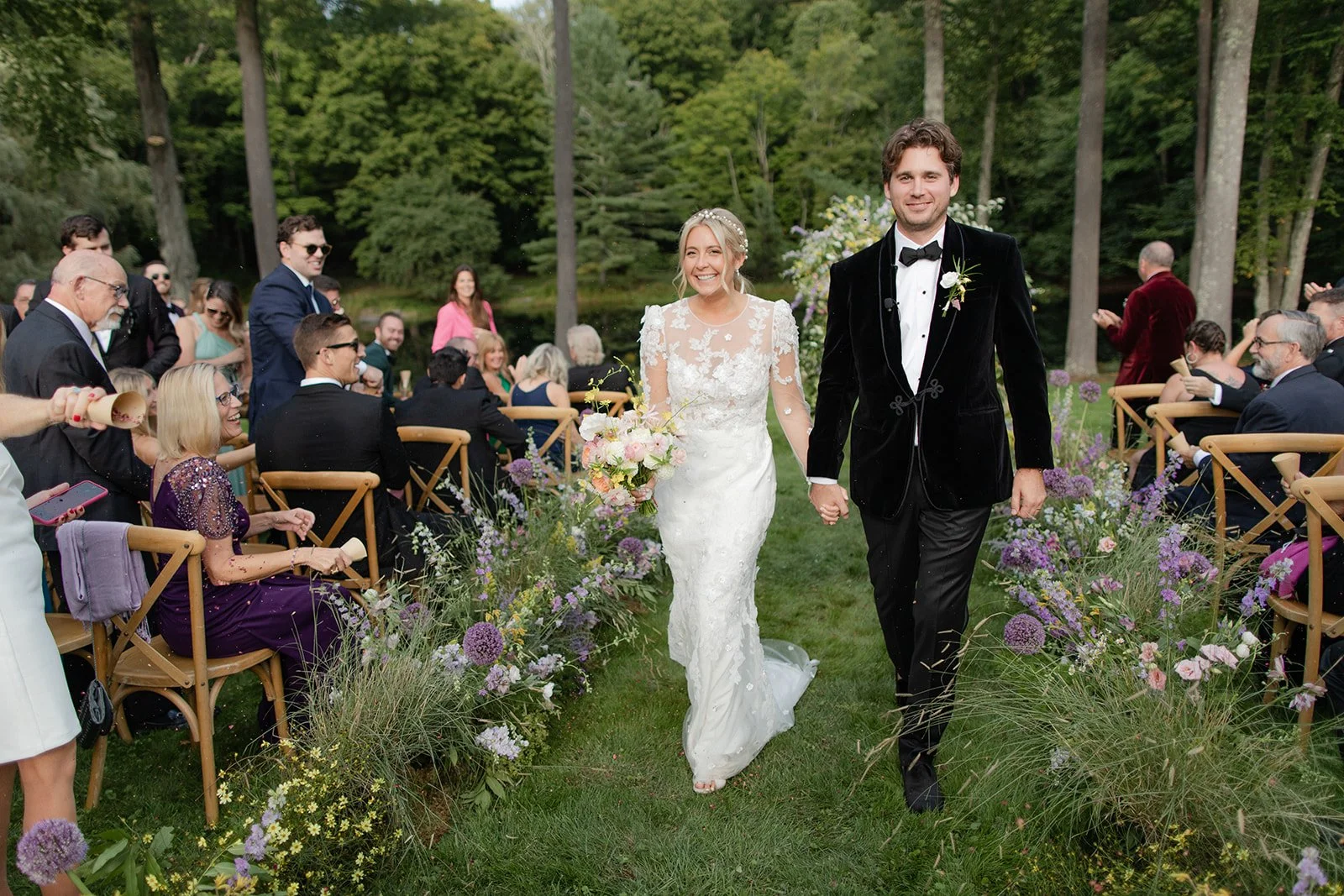 Couple smiling at floral filled Wedding Ceremony designed by 42 North World | Freda Banks Photography | Mayflower Inn & Spa Auberge