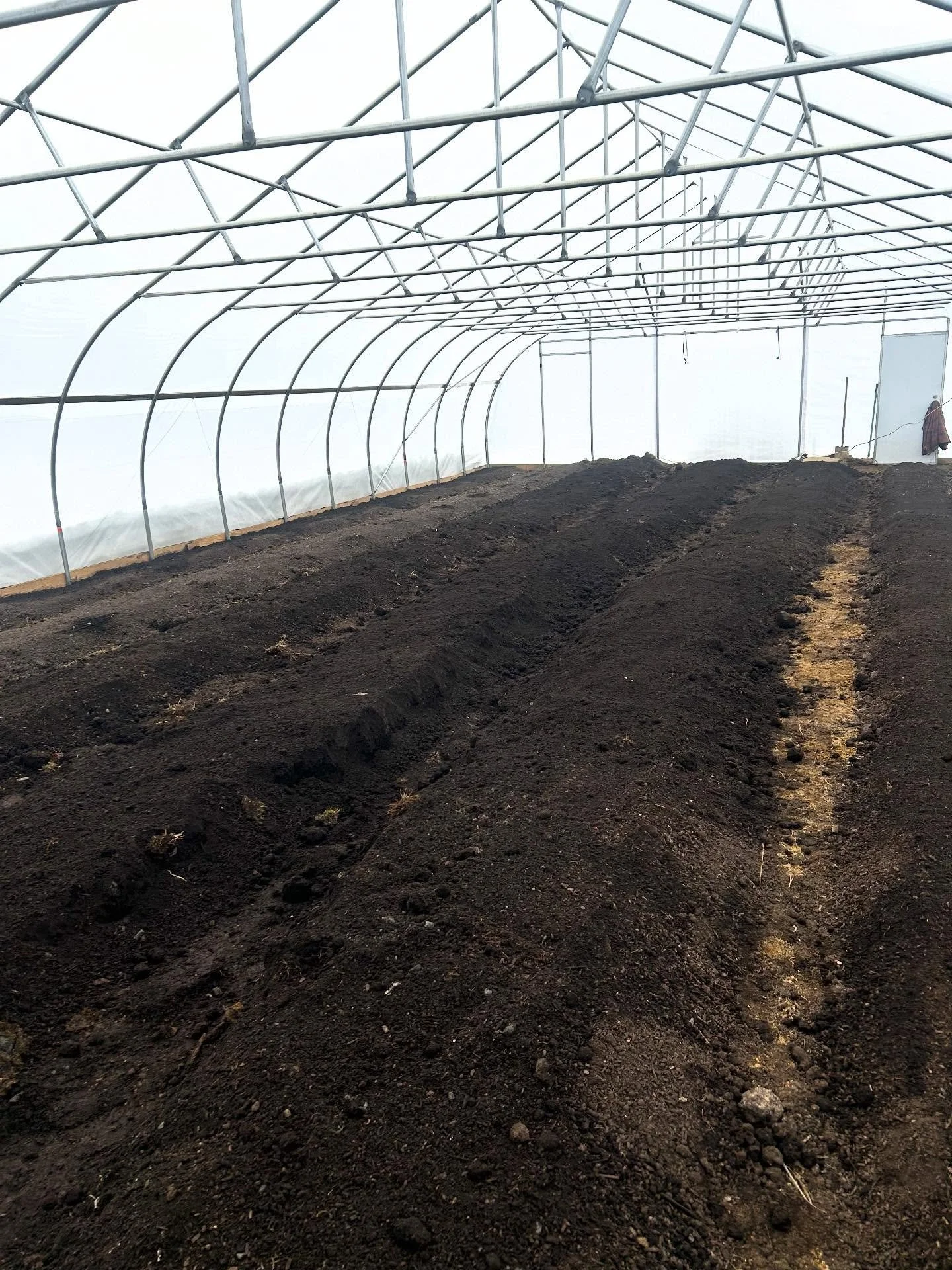Finally finished making beds in our greenhouse, now for the second one.