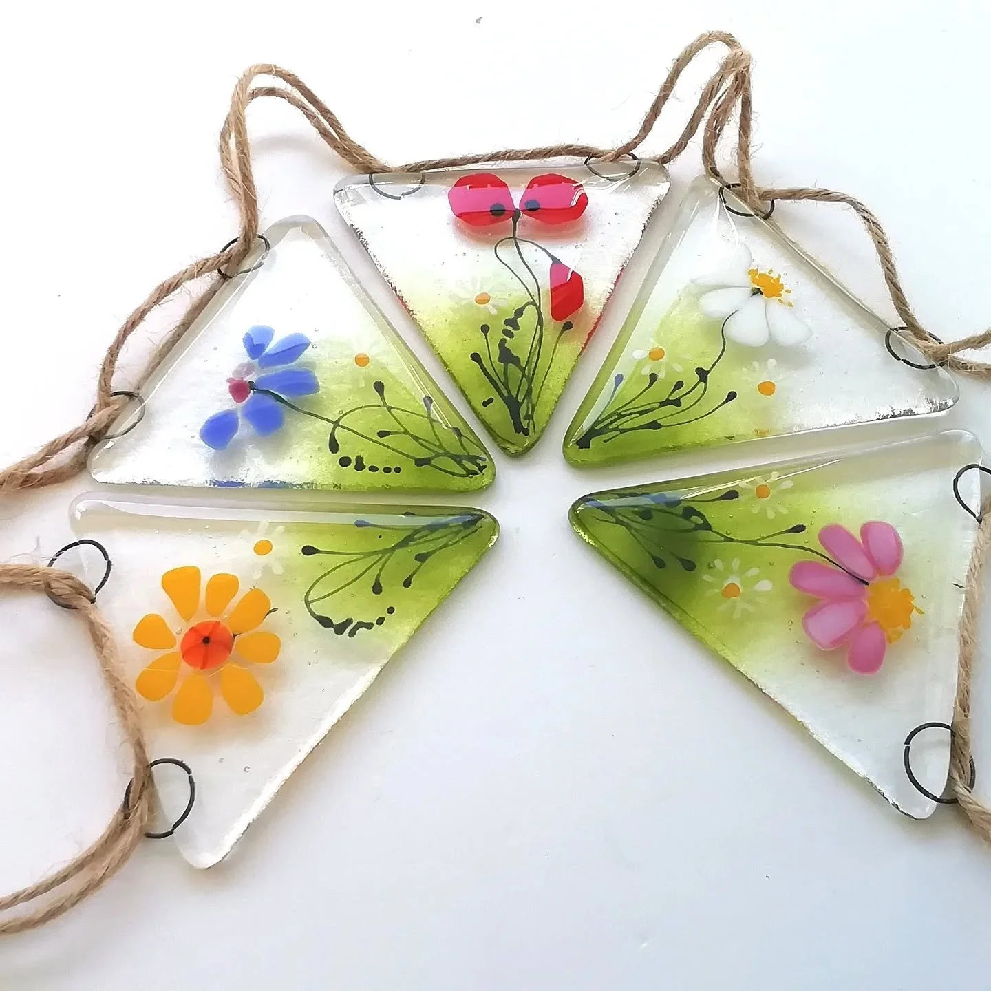 What's everyone up to in this glorious sunshine this weekend? 
This bunting is perfect hanging on a patio with solar lights and happily lives outdoors all year round.
#patiodecor
#fusedglassbunting
#findmeonfolksy
#folksyhq 
#glassartistuk
