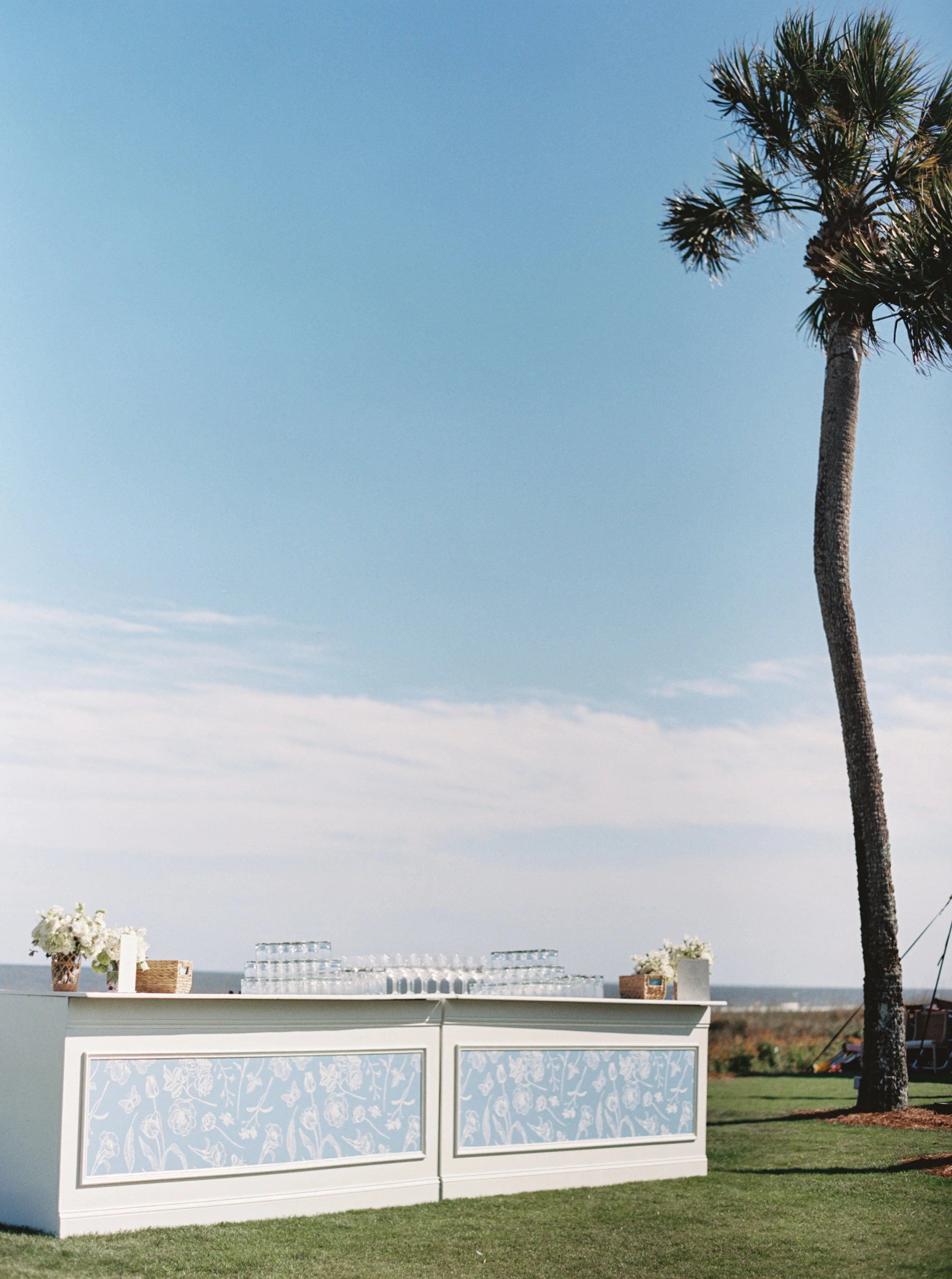 Picturesque oceanside bar takes advantage of the blue sky scene at a Sea Island wedding receiption