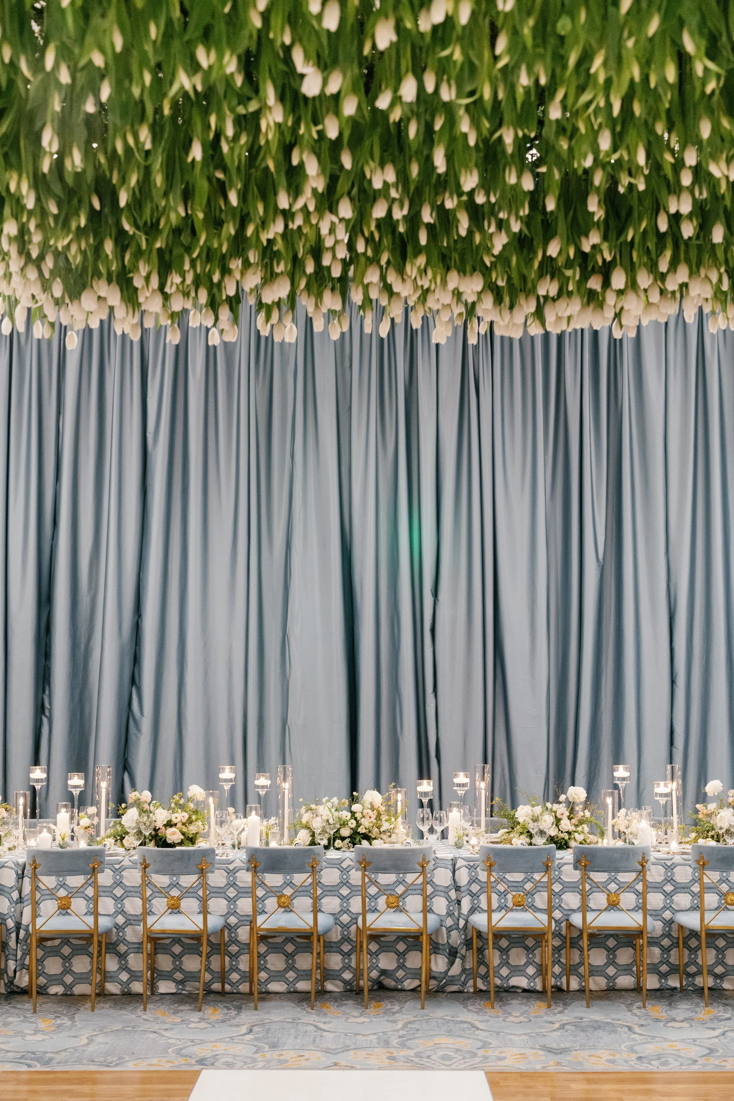 Stunning reception in Palmetto Bluff featuring thousands of fresh tulips hanging from ceiling