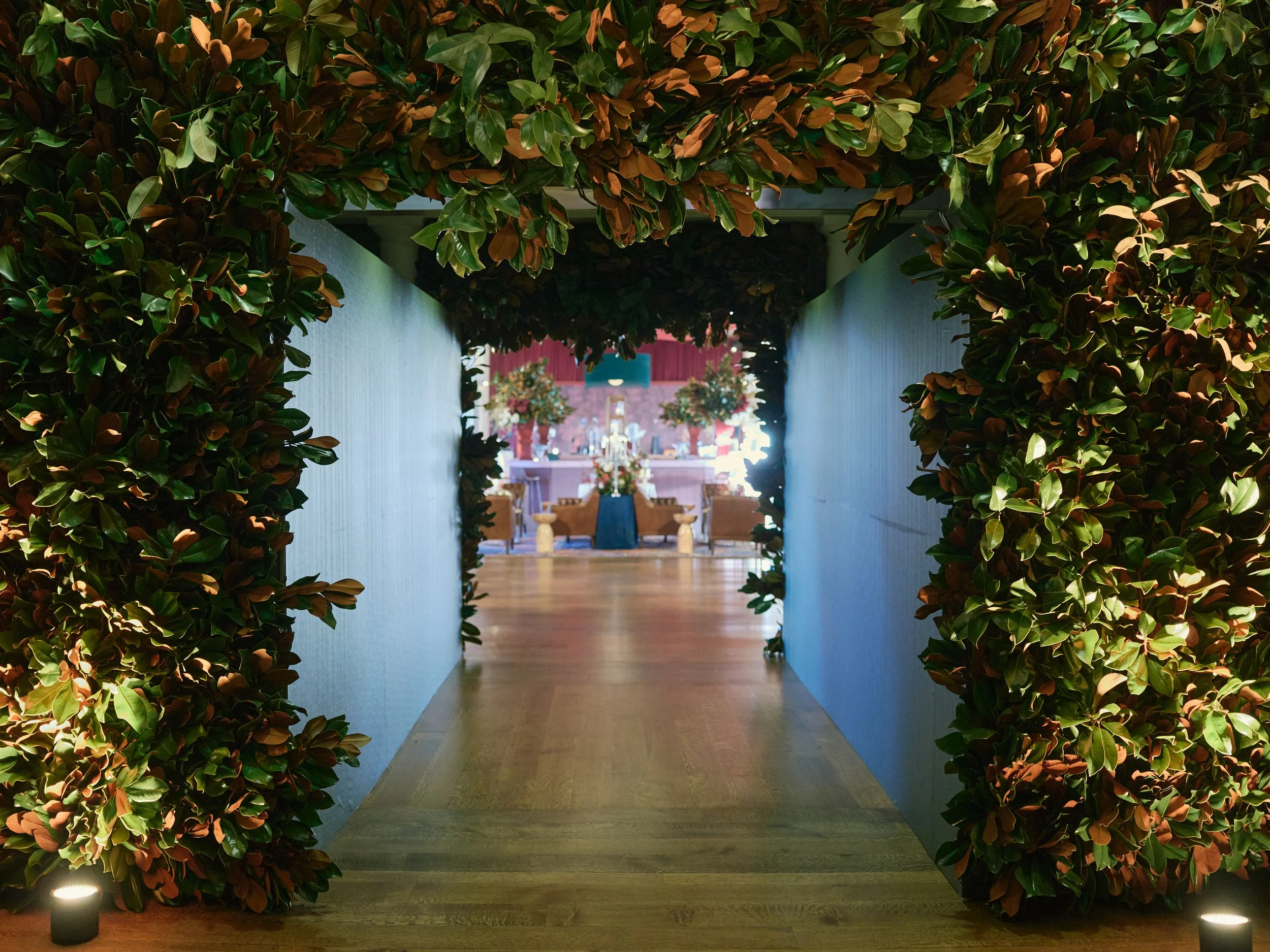 Guests entered this wedding reception through an arch made of magnolia leaves