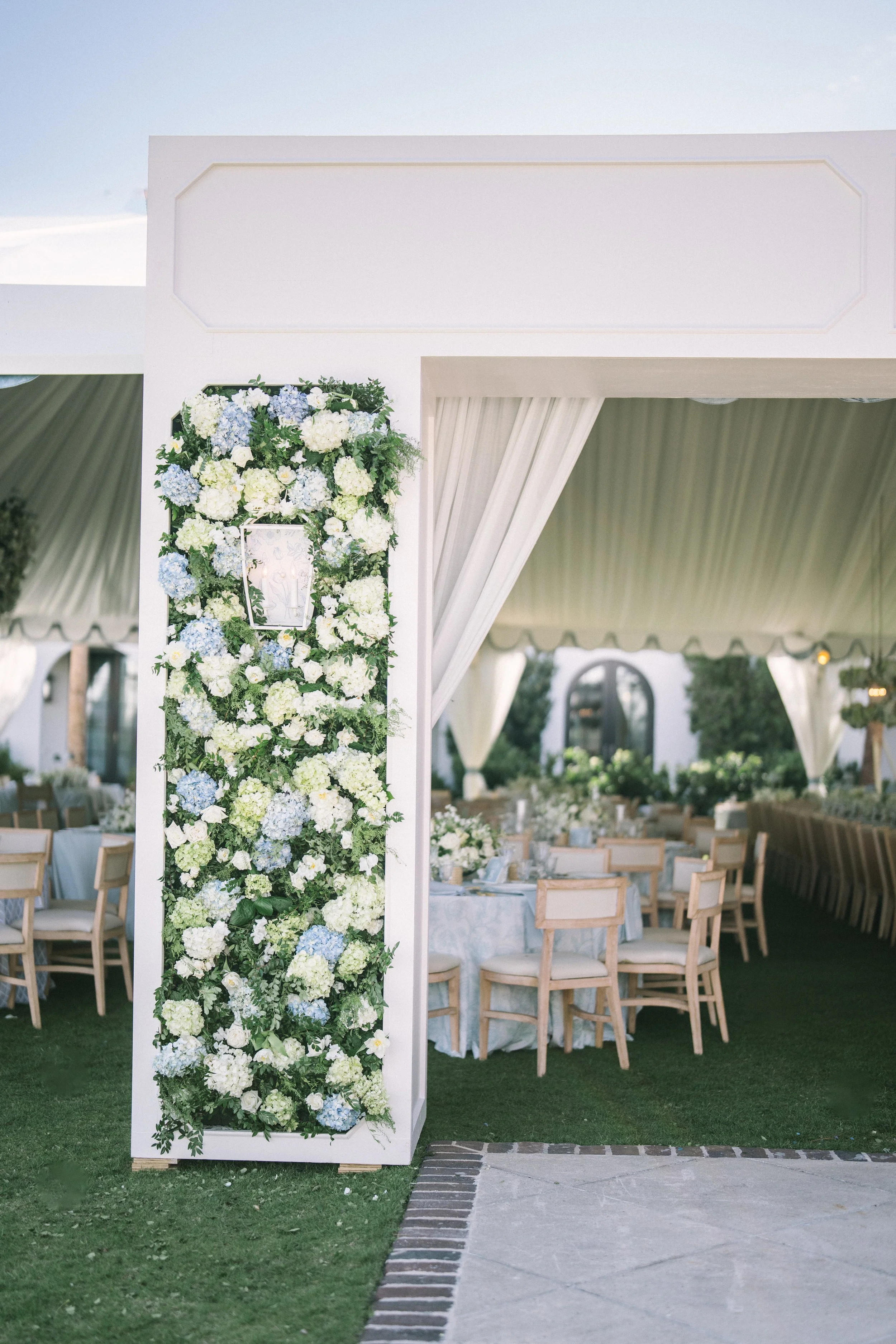 Unique floral wall adds color, whimsy and elegance to this Sea Island wedding reception