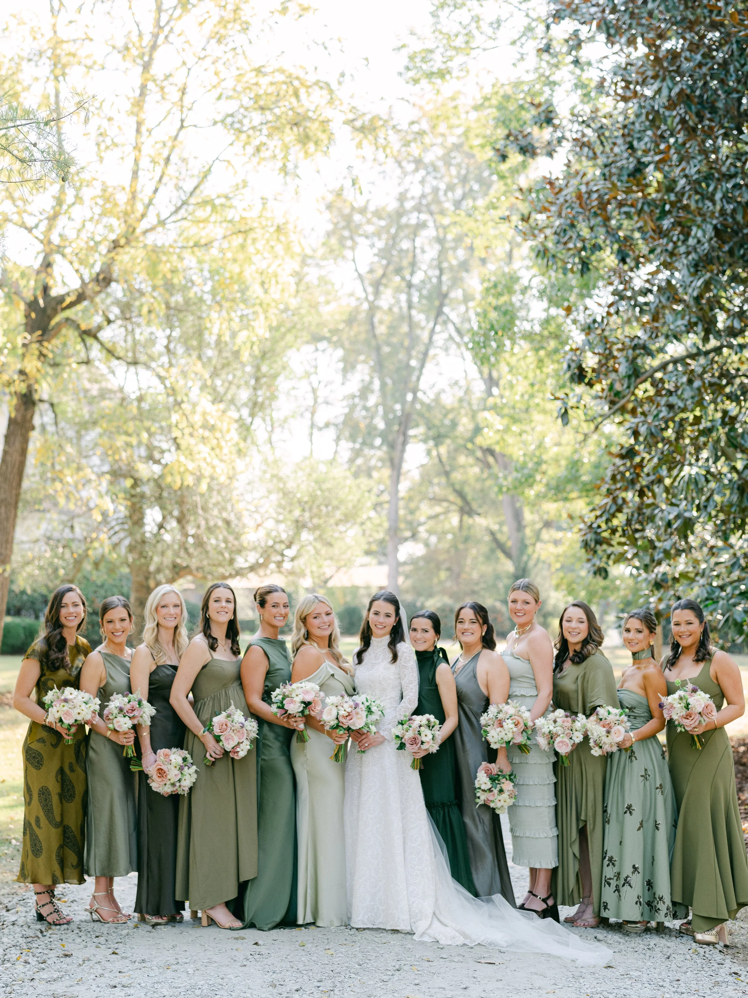 Bridal party shows off bridal party bouquets that add a touch of elegance, featuring unique shapes, soft pinks and greens