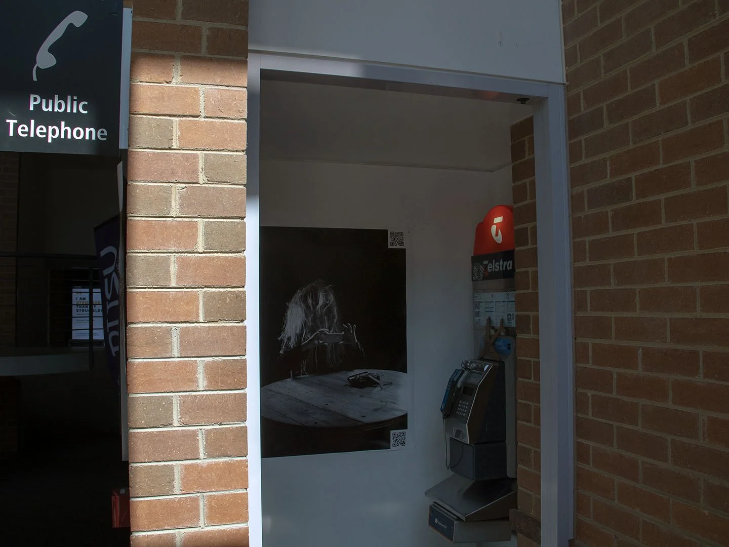 Backyard Psycho (2018)
Manipulated iPhone 6s video | Colour | Stereo Sound |  2' 00" | 23.98 fps |  QR codes embedded in two photographic prints & laser-cut cardboard  | public phone booth