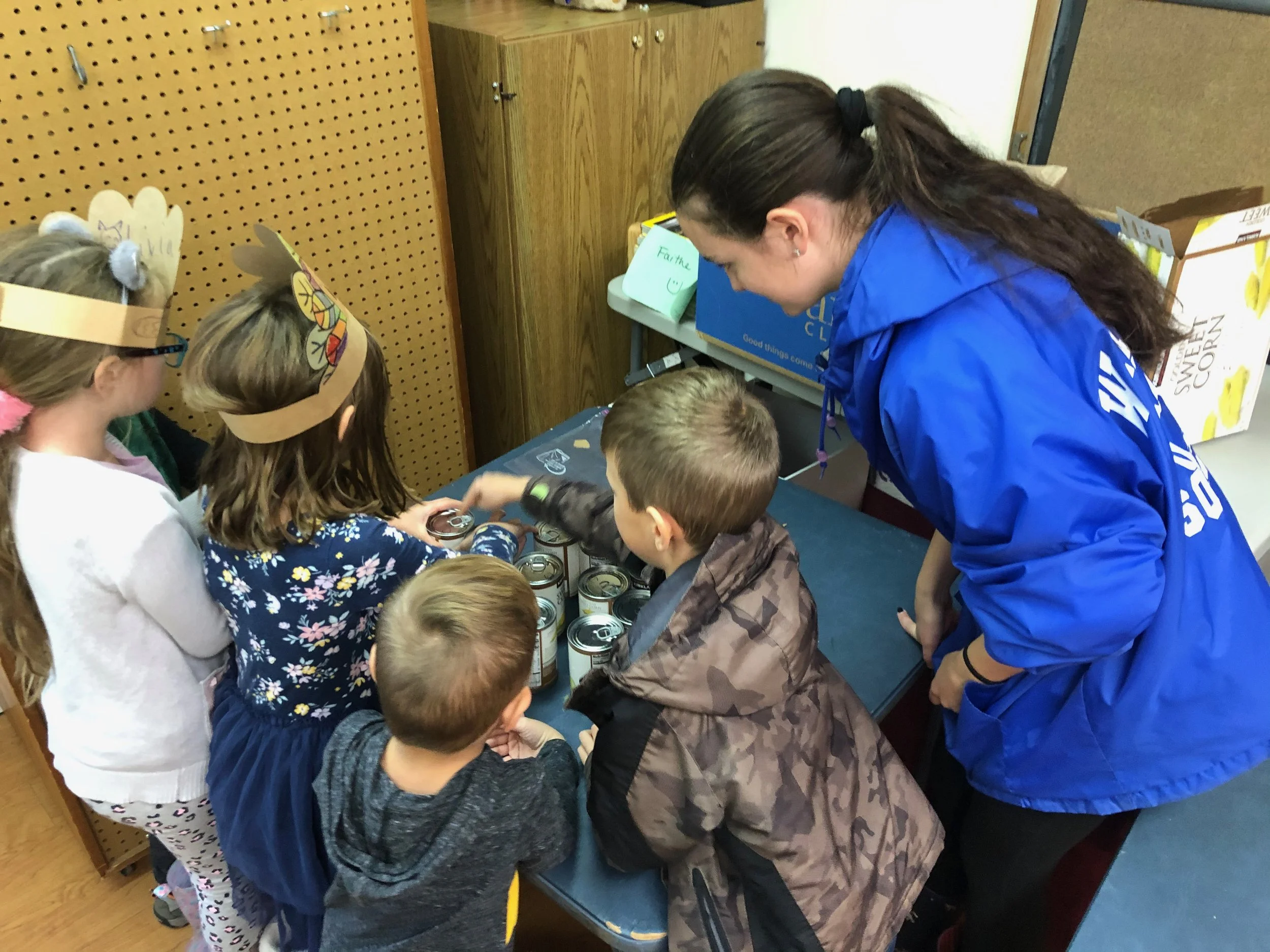 Kids packing a donation box