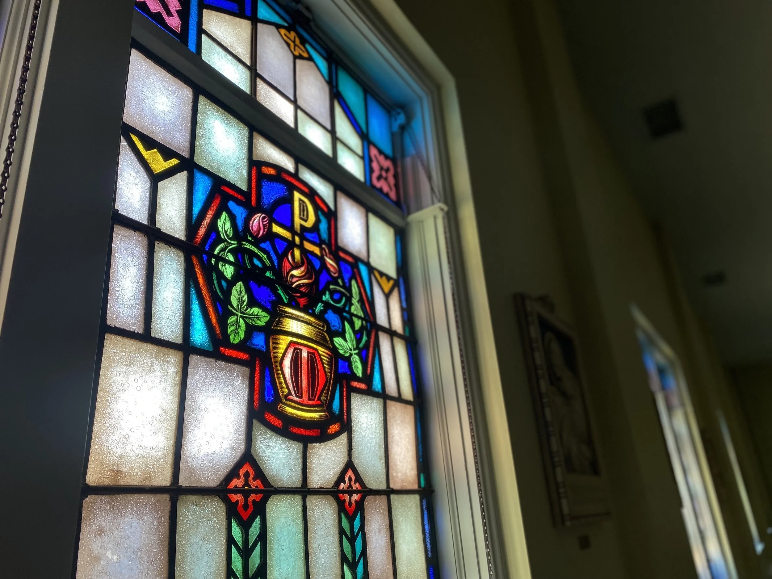 A colorful stained glass window - the Sisters of Mercy