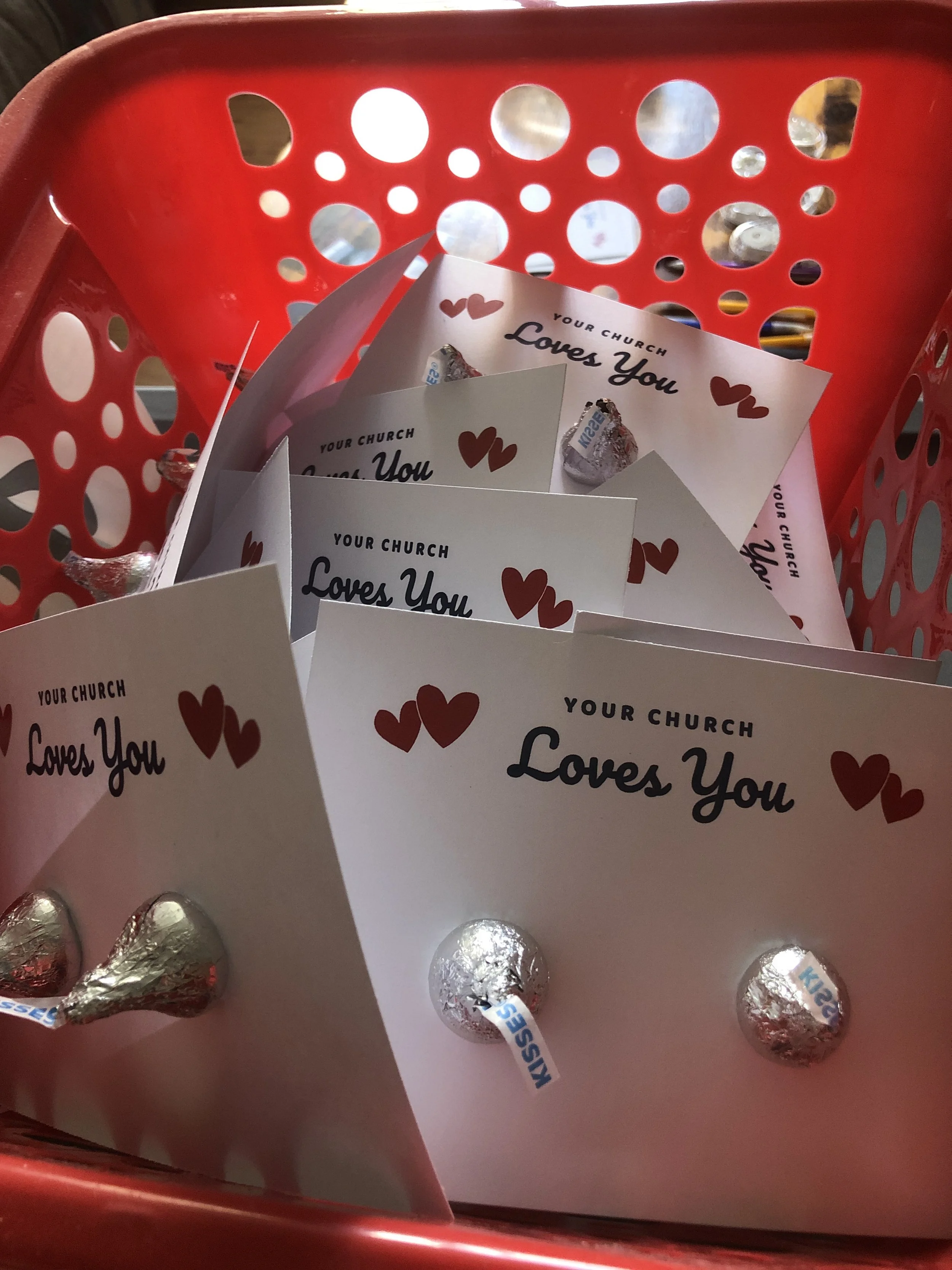 Cards in basket that say Your Church Loves You