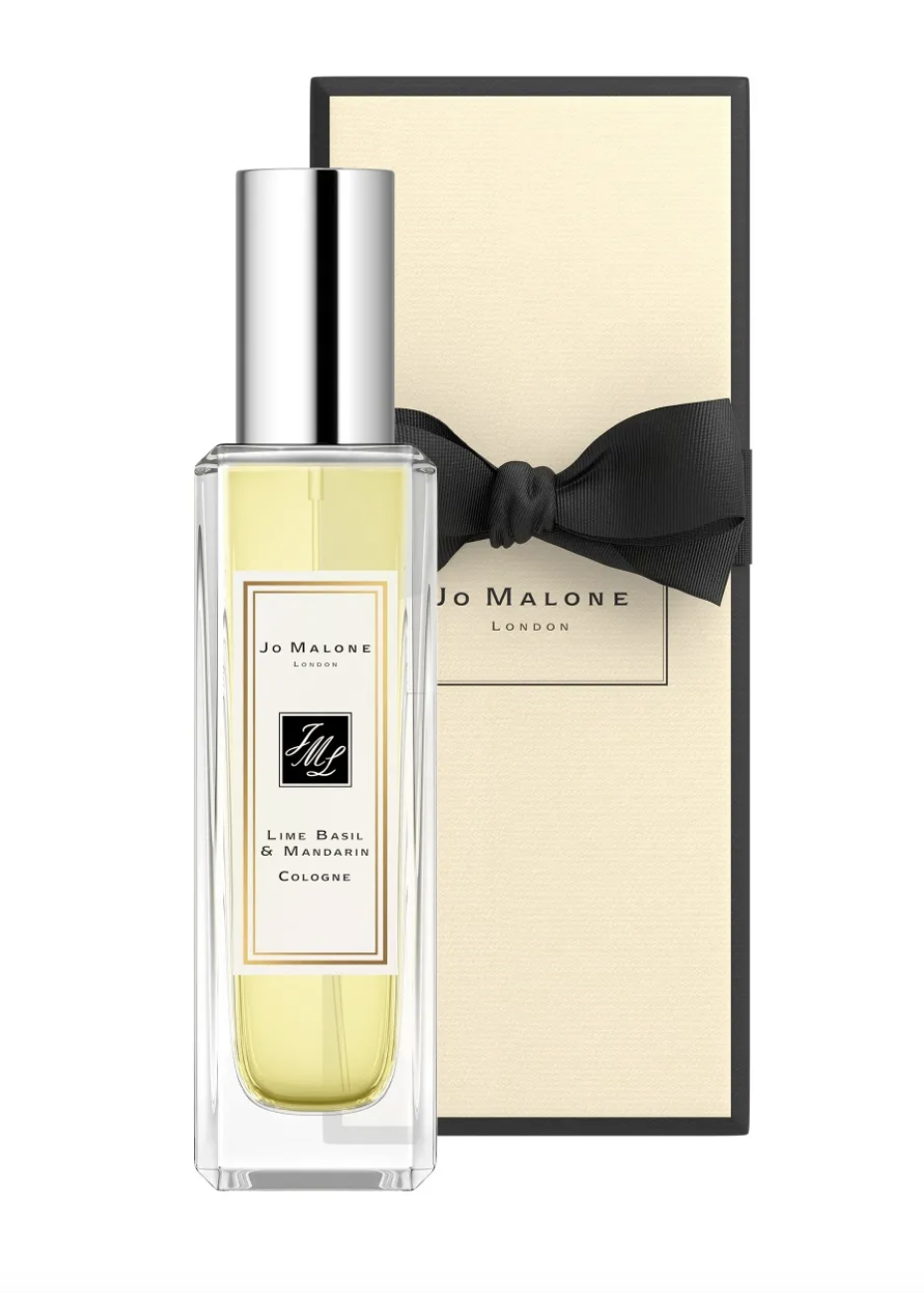 A Jo Malone London cologne bottle with a black ribbon on its cream-colored gift box.