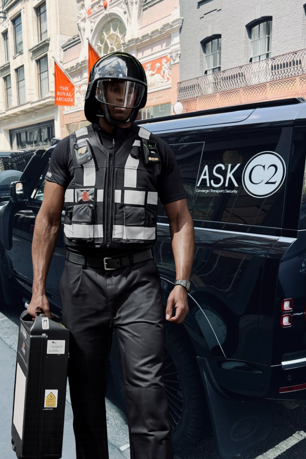 A man in security or police gear standing on city street next to a black van with 'ASK C2' branding. He wears a black helmet with a face shield, a tactical vest, black pants, and holds a rectangular case.