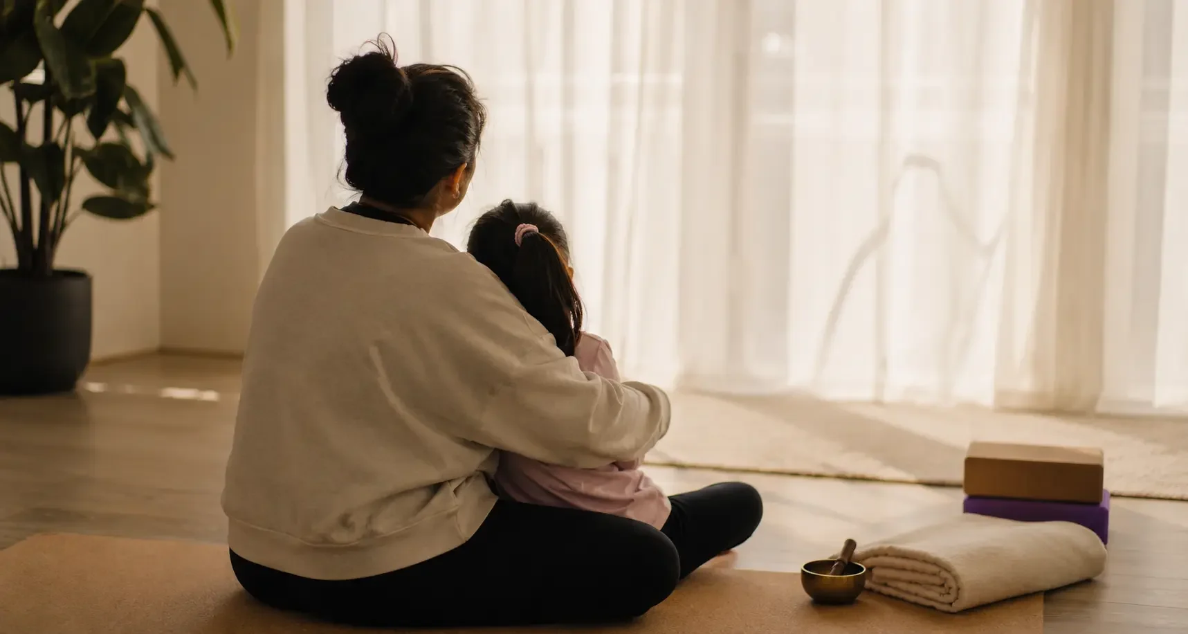 Mum and daughter practicing yoga