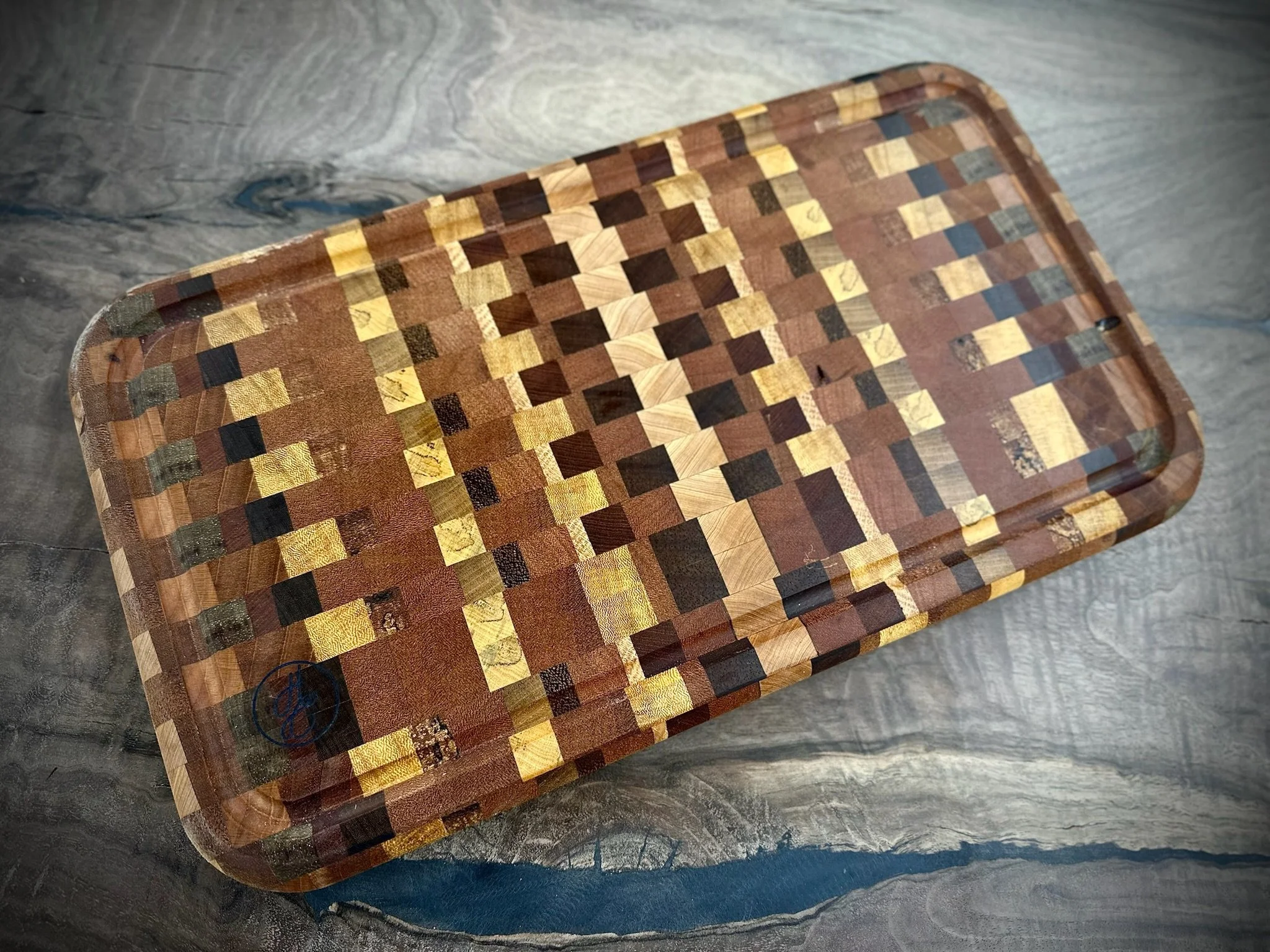 Custom handcrafted wooden cutting boards by Handsome Charlie’s Customs in Lexington, Kentucky, made from premium hardwood with expert craftsmanship, showcasing rich natural grain, durable construction, and a food-safe finish.