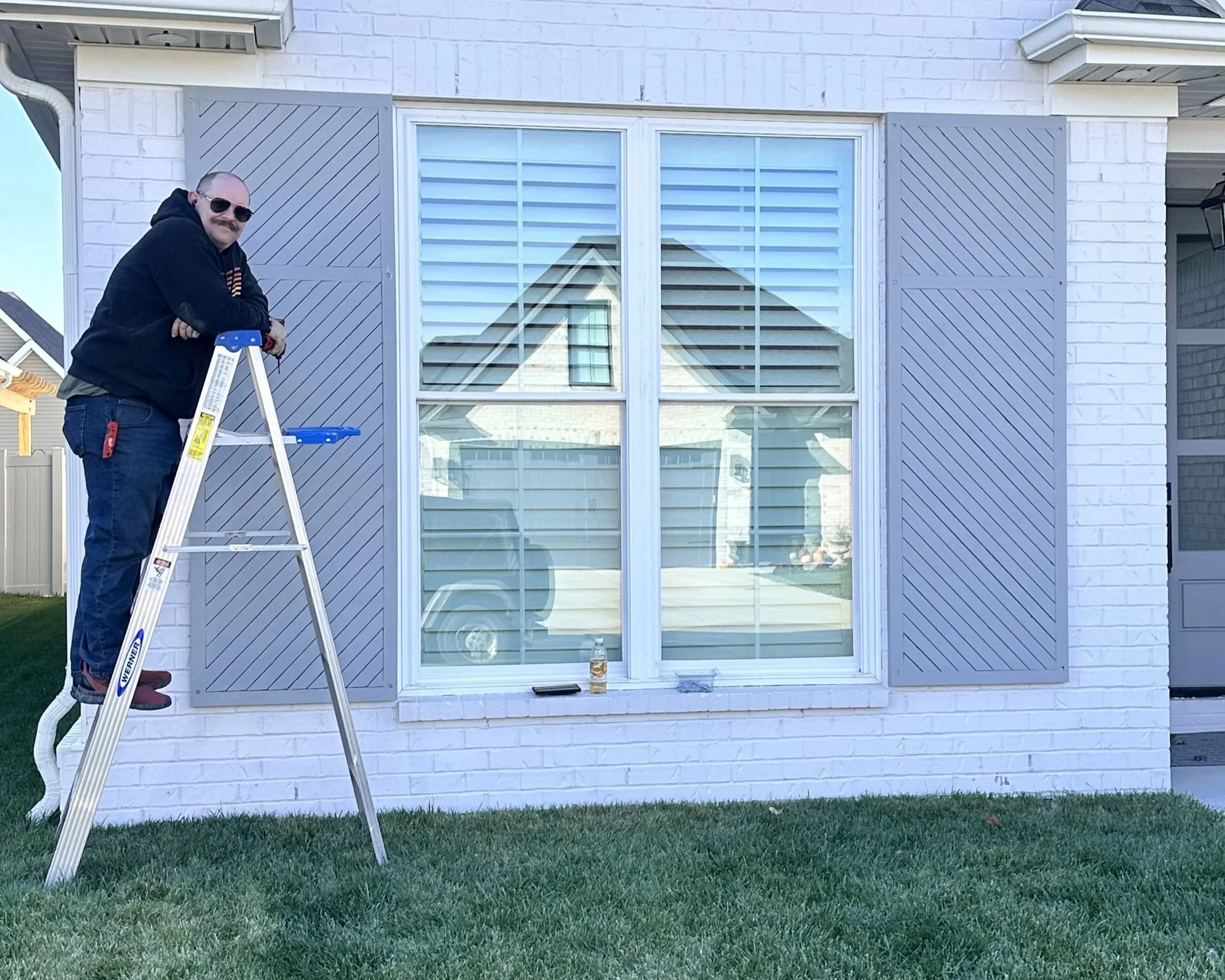 Handsome Charlies Customs installing professional Blinds up in Lexington Kentucky. He provides construction services as well.