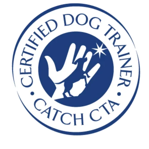 A circular logo with a blue background. It features a stylized hand making a dog training gesture, with a star above it. The text around the circle reads 'Certified Dog Trainer' at the top and 'Catch CTA' at the bottom.