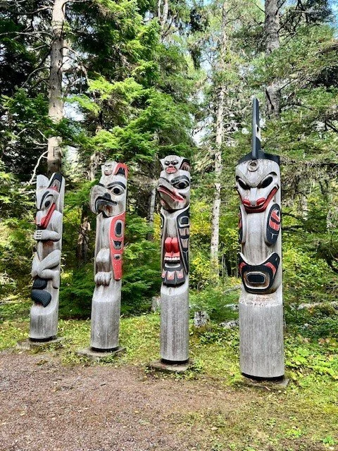 Carved wooden poles at the Kitselas Canyon National Historic Site